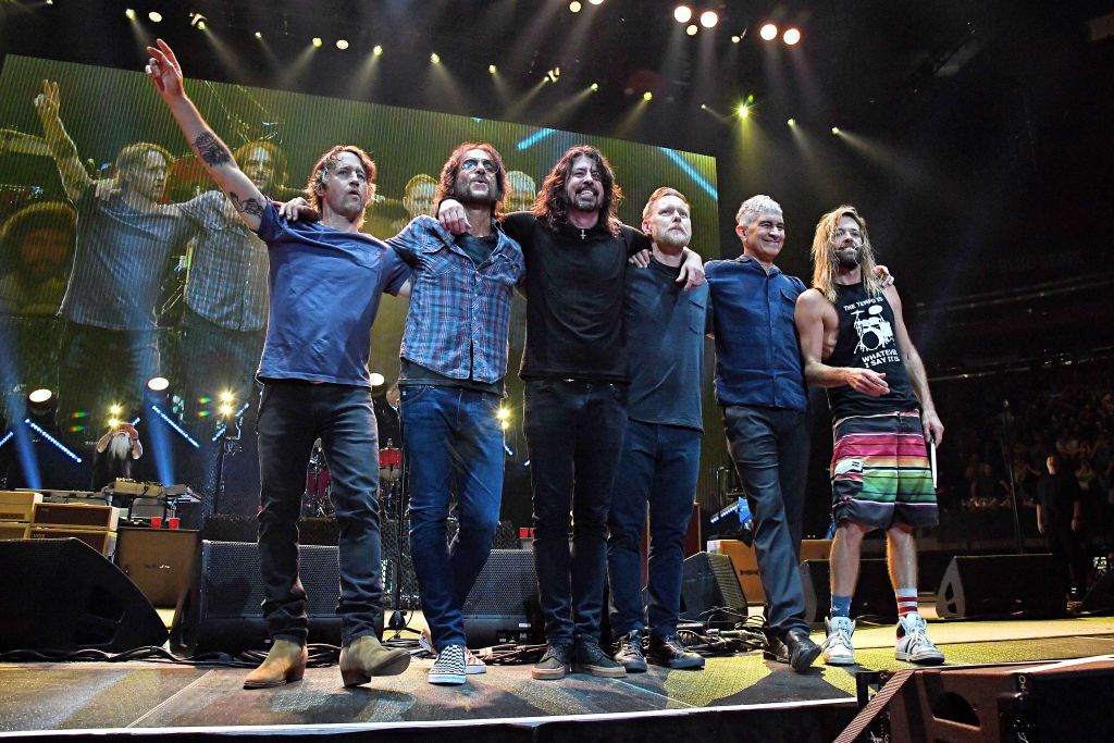 L-R) Chris Shiflett, Rami Jaffee, Dave Grohl, Nate Mendel, Pat Smear and Taylor Hawkins pose onstage as The Foo Fighters reopen Madison Square Garden on June 20, 2021 in New York City. The concert, with all attendees vaccinated, is the first in a New York