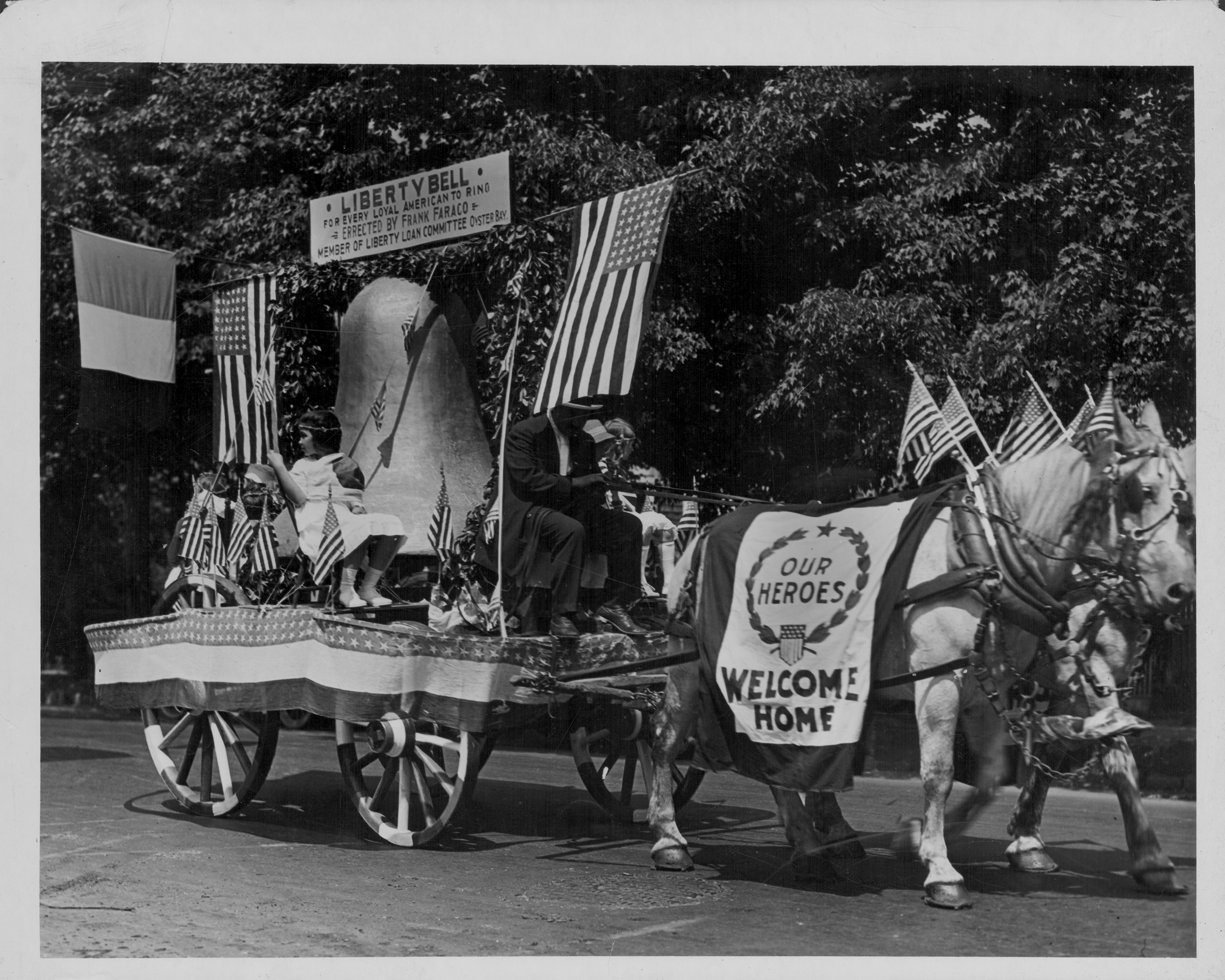 A parade float welcoming home the troops during World War One; also carrying the Liberty Bell