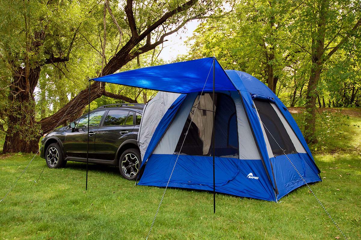 Napier Sportz Dome To Go on black wagon in a forest.