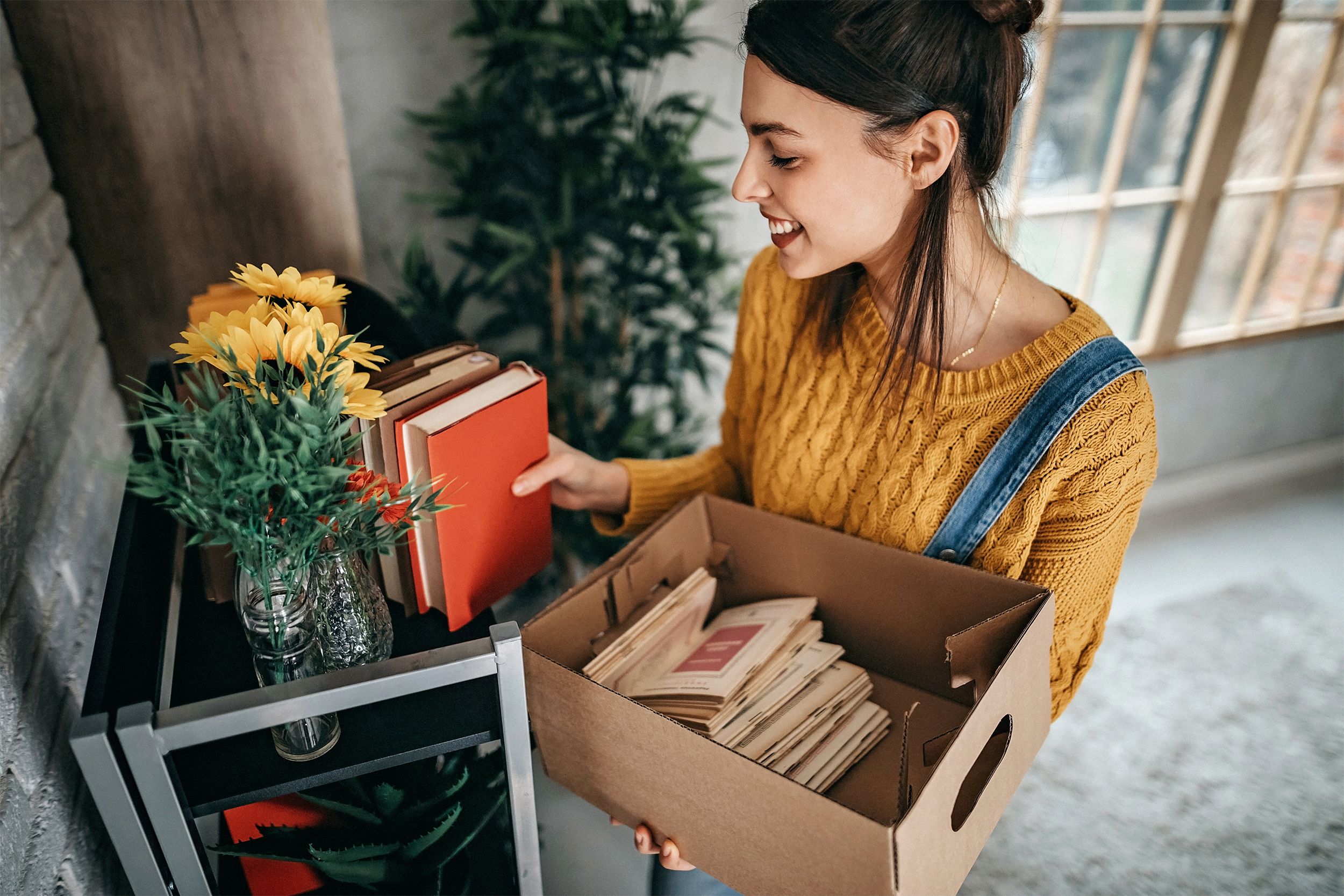 Women arranging stuff in new apartment