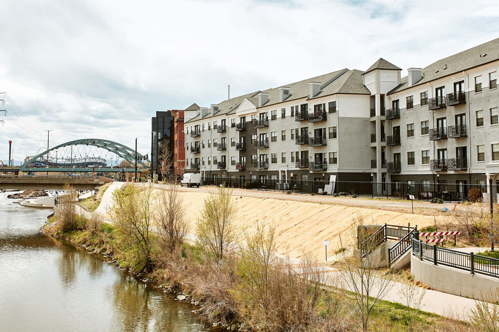 South Platte River Bridge, surrounded by modern apartments and office buildings in Commons Park . Denver, Colorado