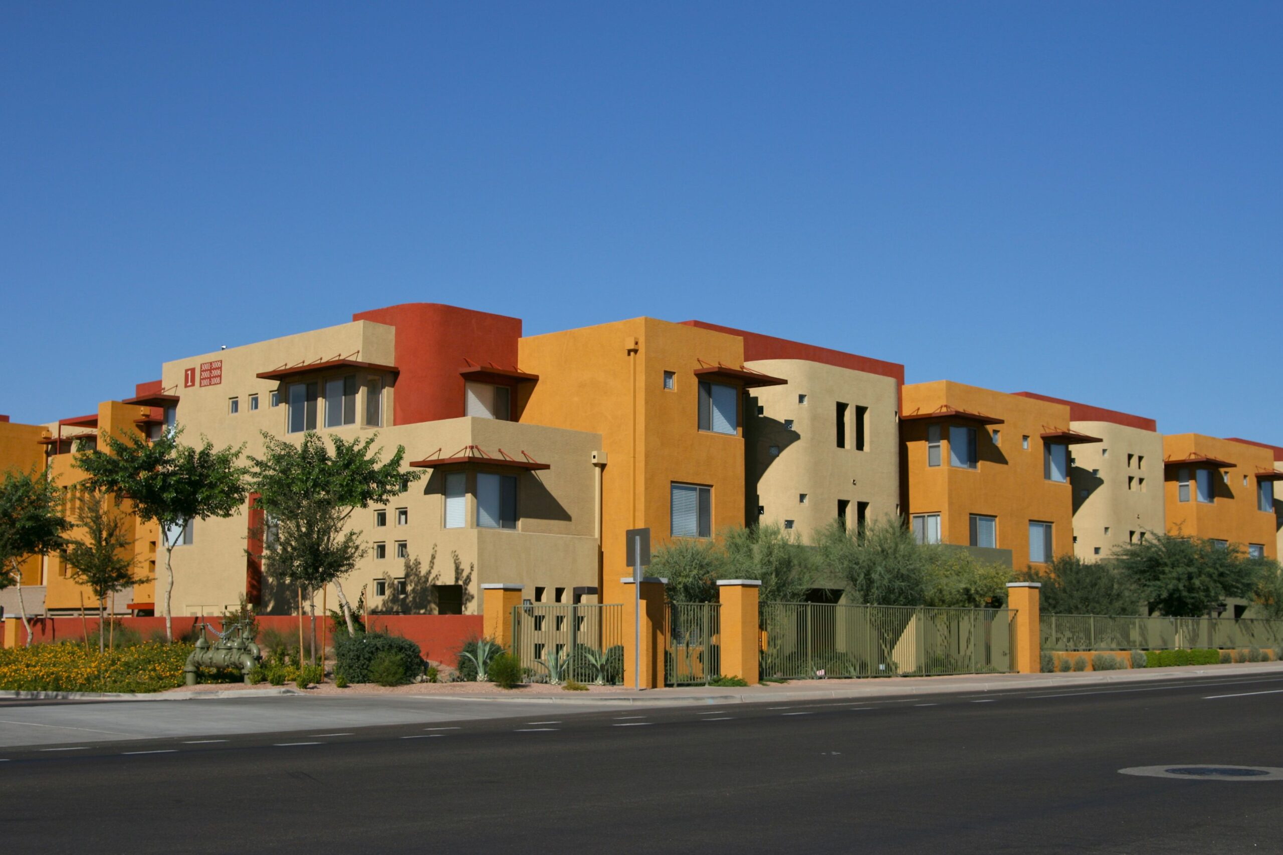 Street views of vibrantly colored luxury apartments in north Scottsdale, AZ with street for copy space (how convenient!)