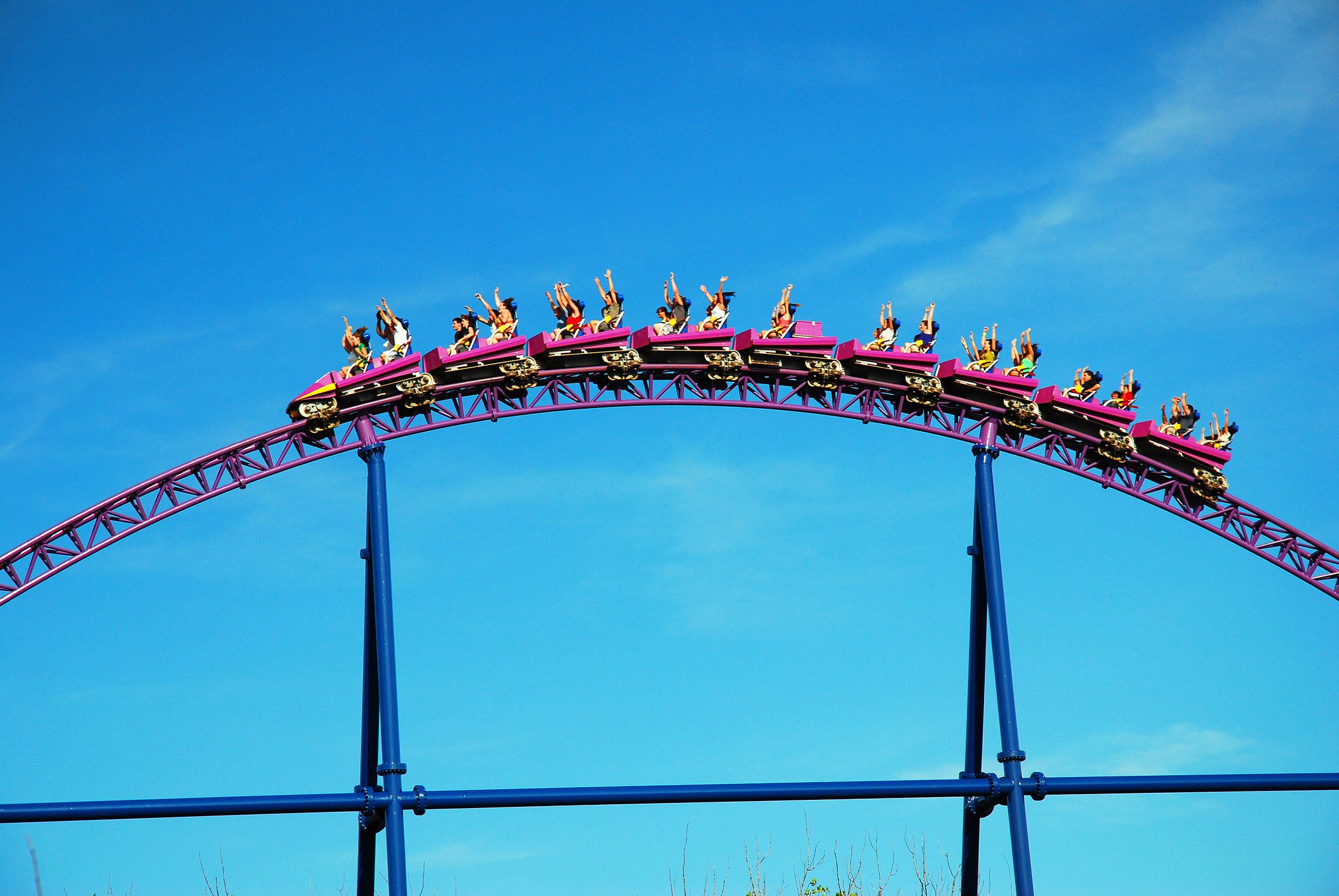 Agawam, MA, USA July 14, 2009 Up and Over: riders crest a hill on the Superman the Ride rollercoaster in Agawam , Massachusetts. The coaster consistently rates as one of the best in the world