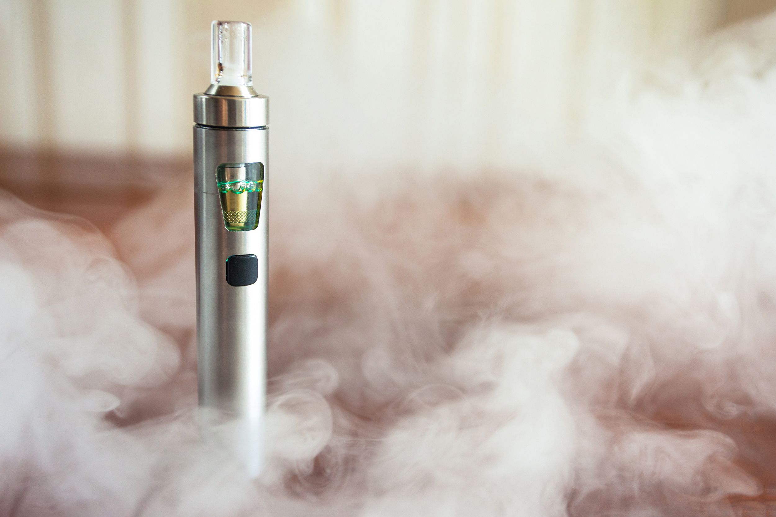 electronic cig with smoke around it