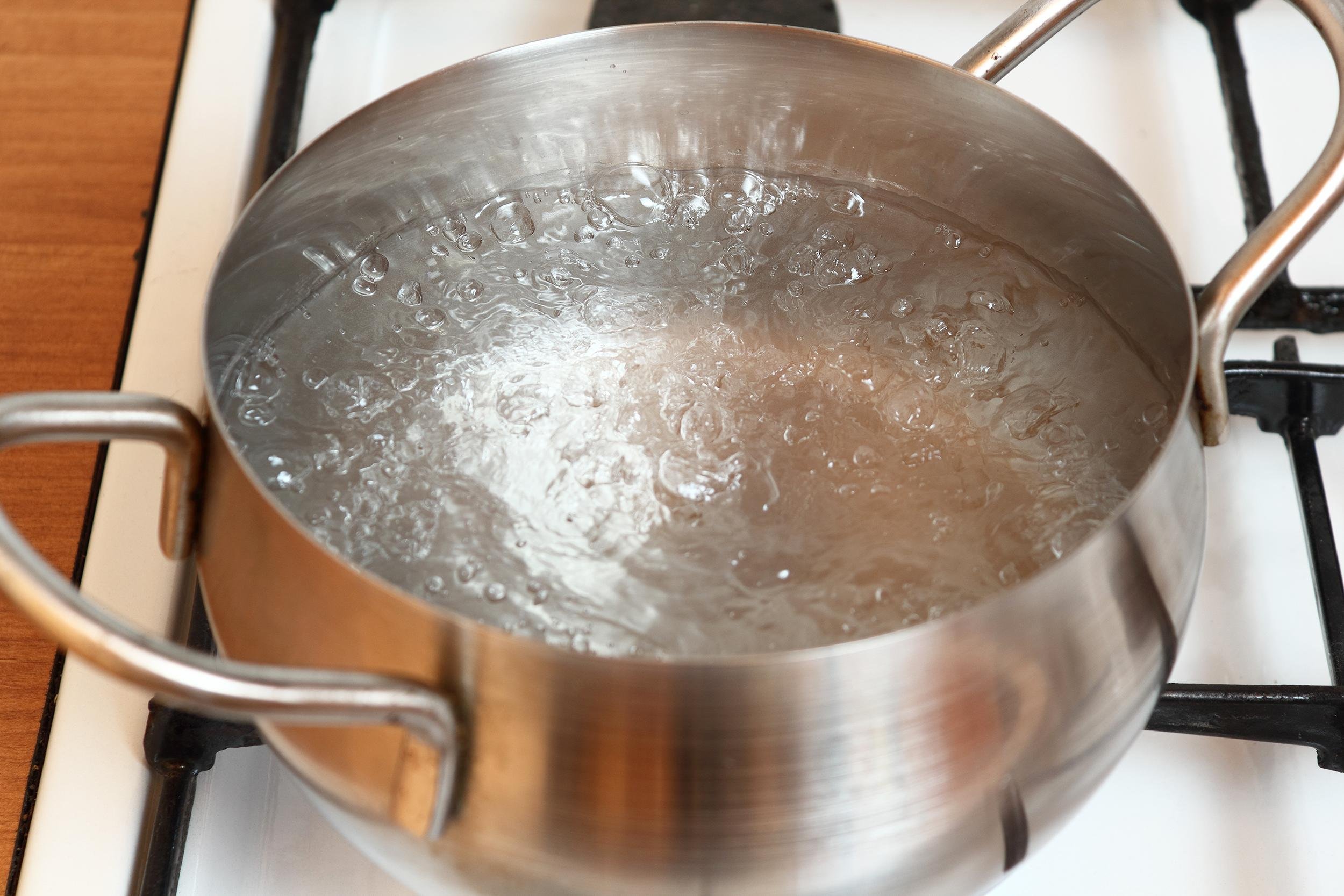bottling pot of water on stove