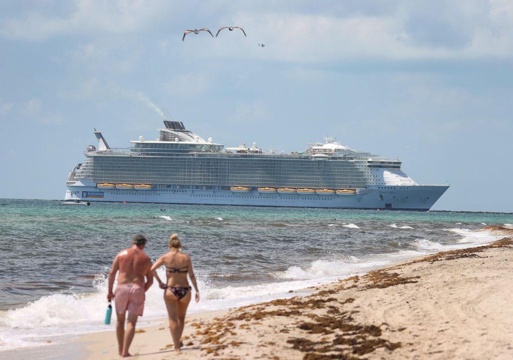 he Royal Caribbean Oasis of the Seas cruise ship sails past as it prepares to dock at PortMiami on May 28, 2021 in Miami Beach, Florida.