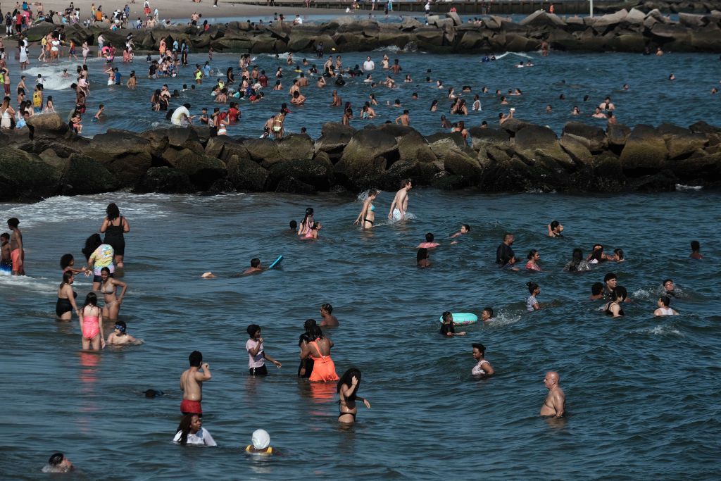 People cool off at Coney Island beach in Brooklyn on one of the first hot days of the year on June 28, 2021 in New York City. New York City is under a heat advisory with temperatures in the nineties but with humidity making it feel much hotter.