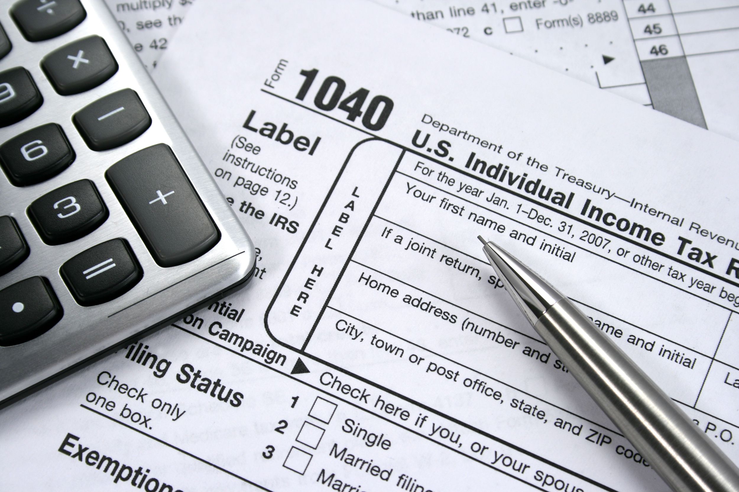 Closeup of 1040 and a calculator