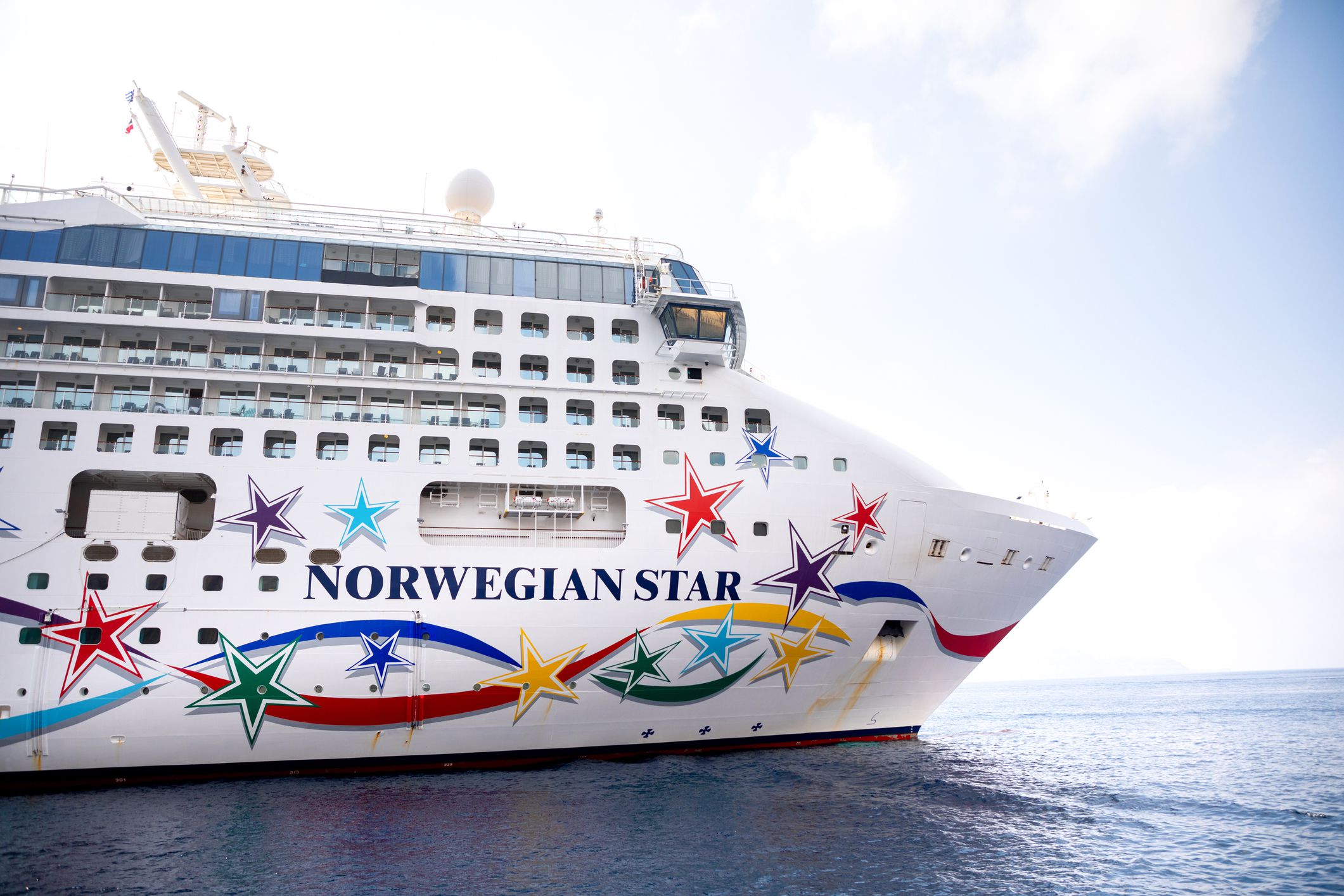Thira, Santorini, Greece - October 18, 2018: Norwegian Star is a cruise ship owned and operated by Norwegian Cruise Line shipyard in Santorini in Greece