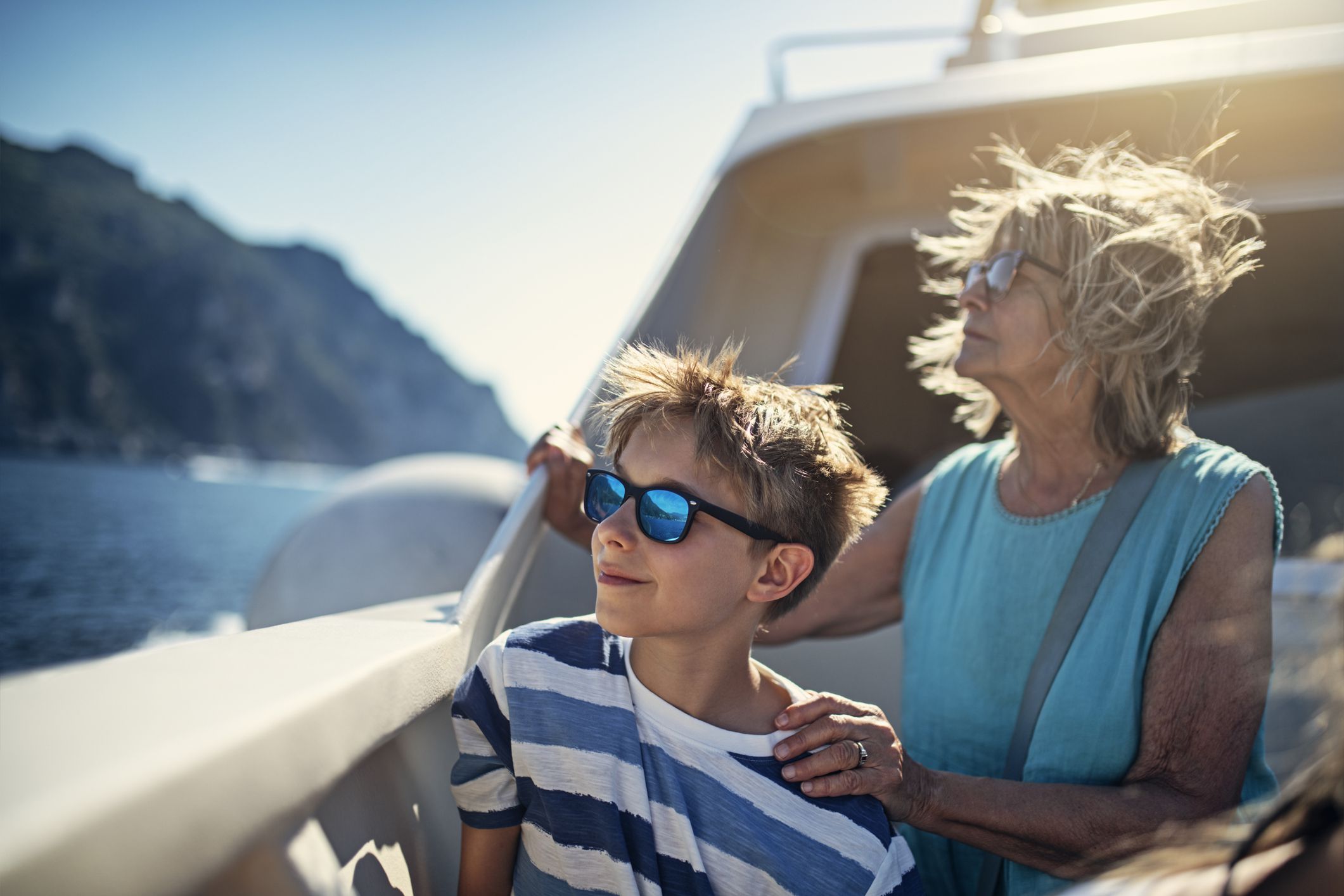 Senior woman and grandson enjoying ferry boat ride to the famous city of Amalfi in Campania, Italy.Nikon D850