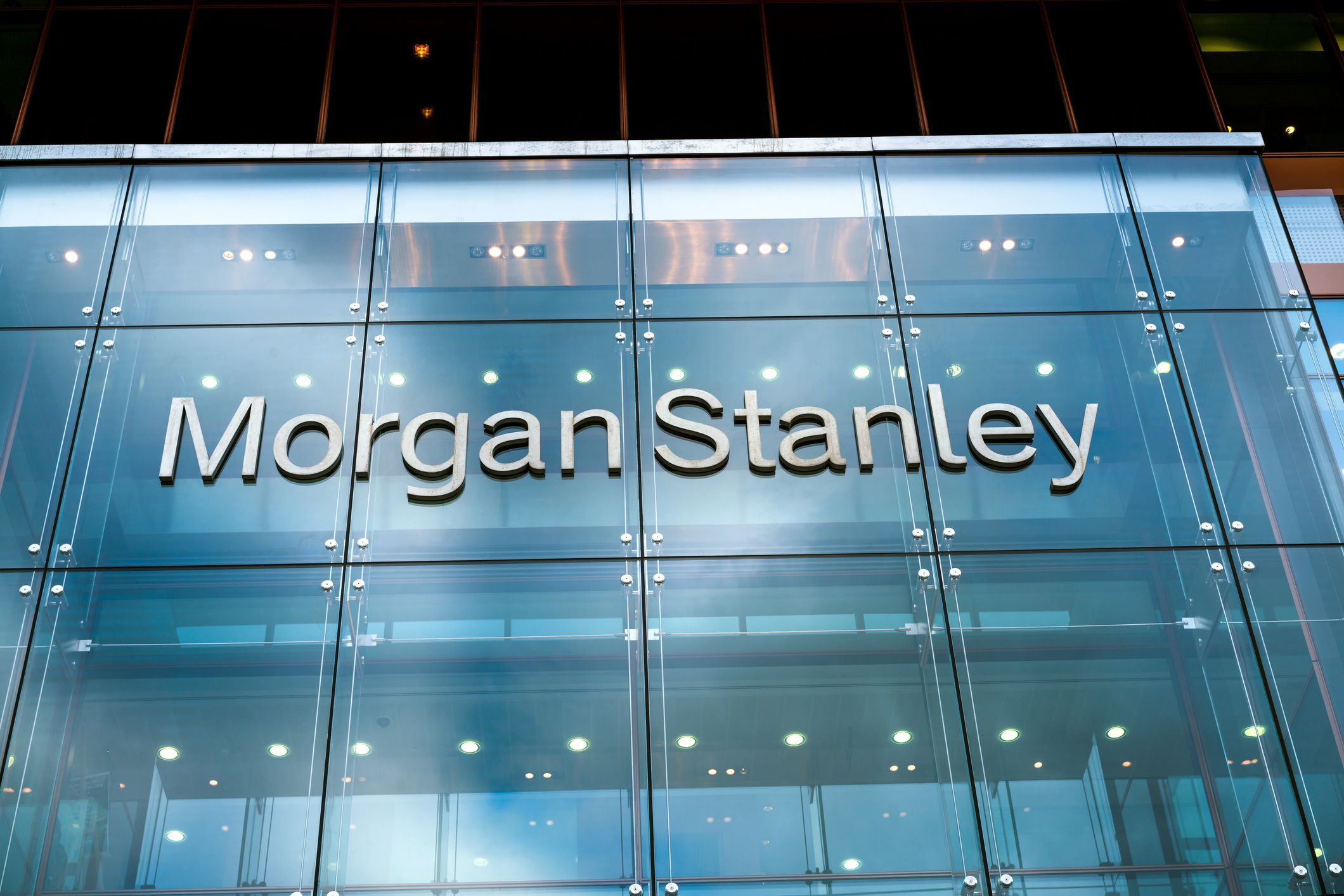London, UK - September 4, 2015: The facade and sign of modern bank building from Morgan Stanley with reflections.