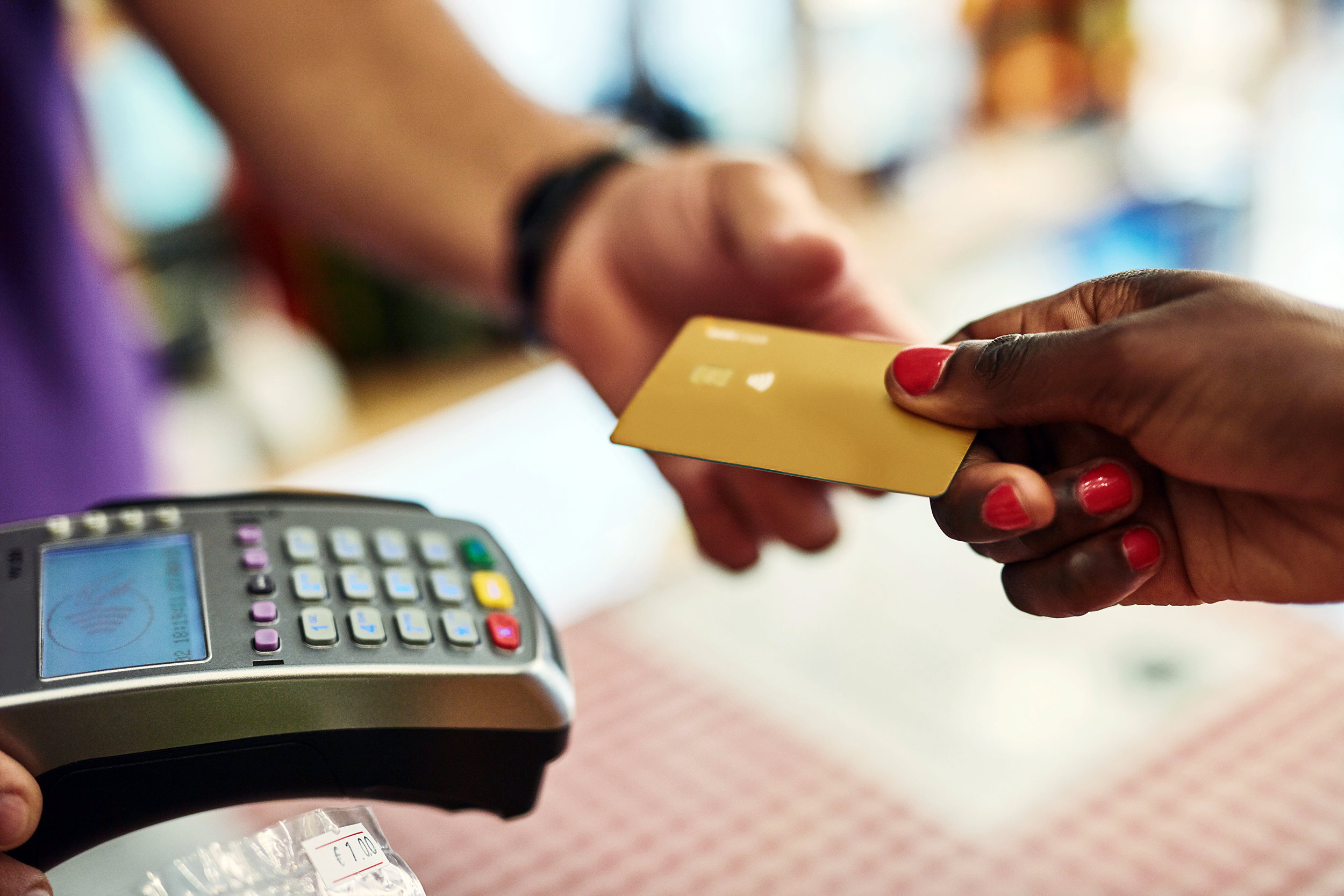 Closeup of woman paying with a credit card