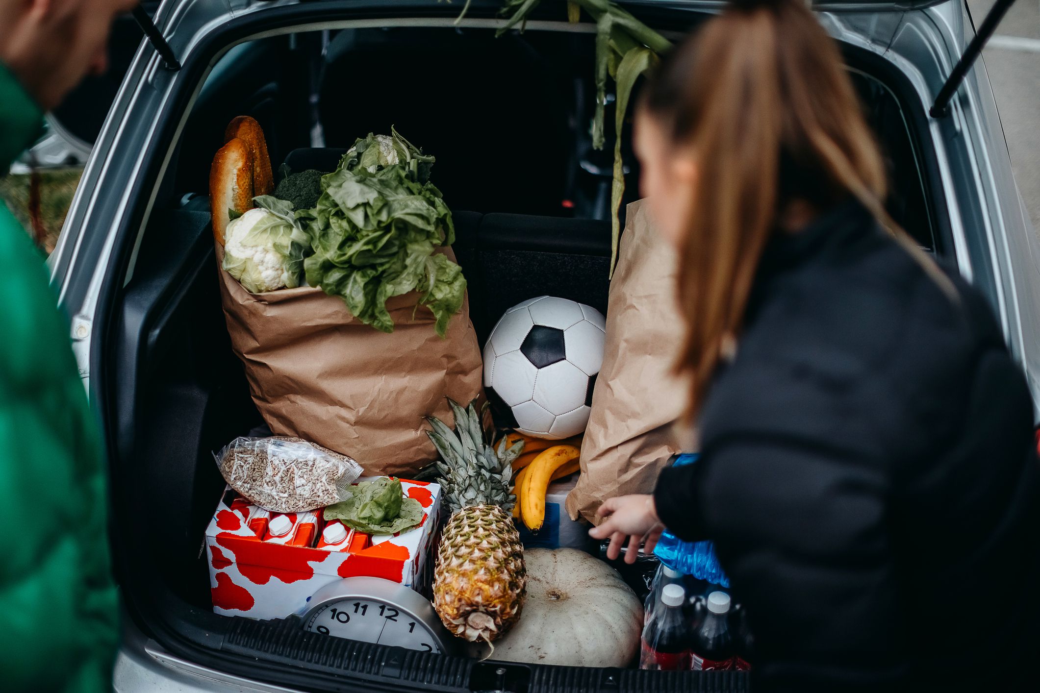 Two people on parking spot after shopping