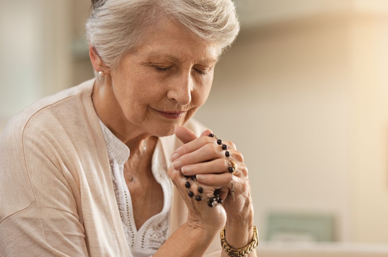 senior woman praying