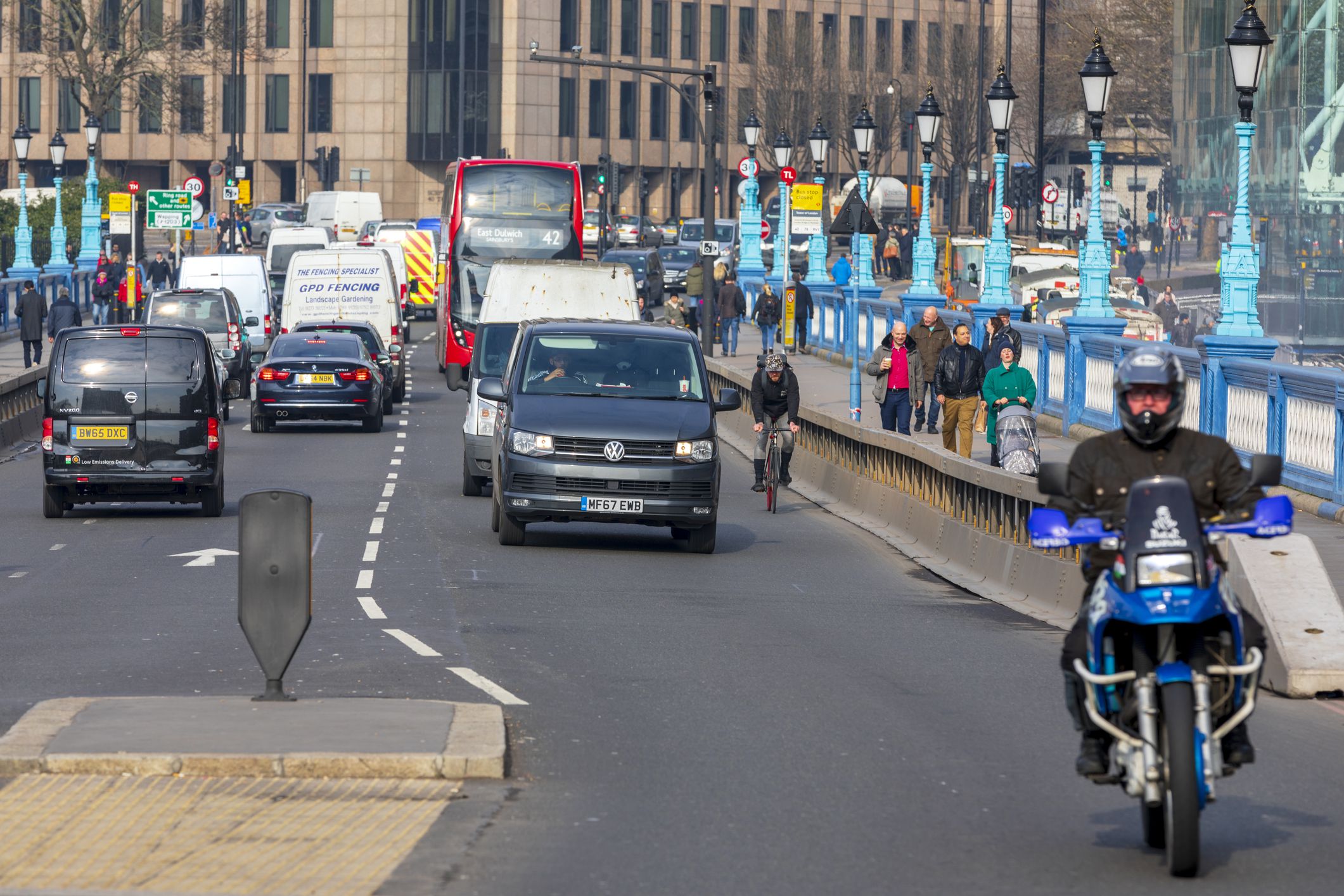 London, UK - February 21, 2018: Traffic and pedestrians on a busy street leading towards the City of London