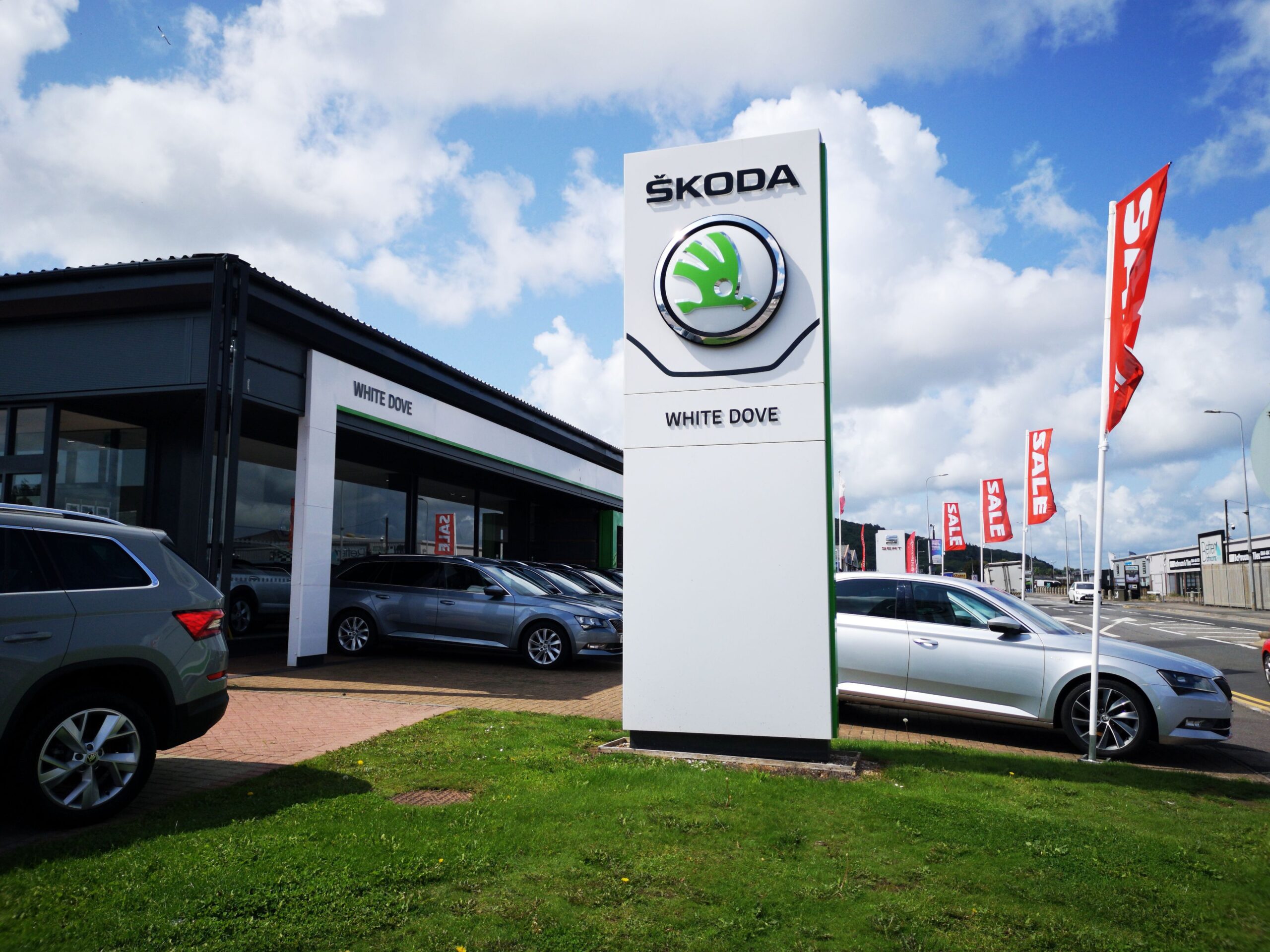 Cardiff, UK: August 19, 2019: Skoda Car Dealership with new and used cars for sale. ŠKODA AUTO, more commonly known as Škoda, is a Czech automobile manufacturer founded in 1895. Its headquarters are in Mladá Boleslav, Czech Republic.