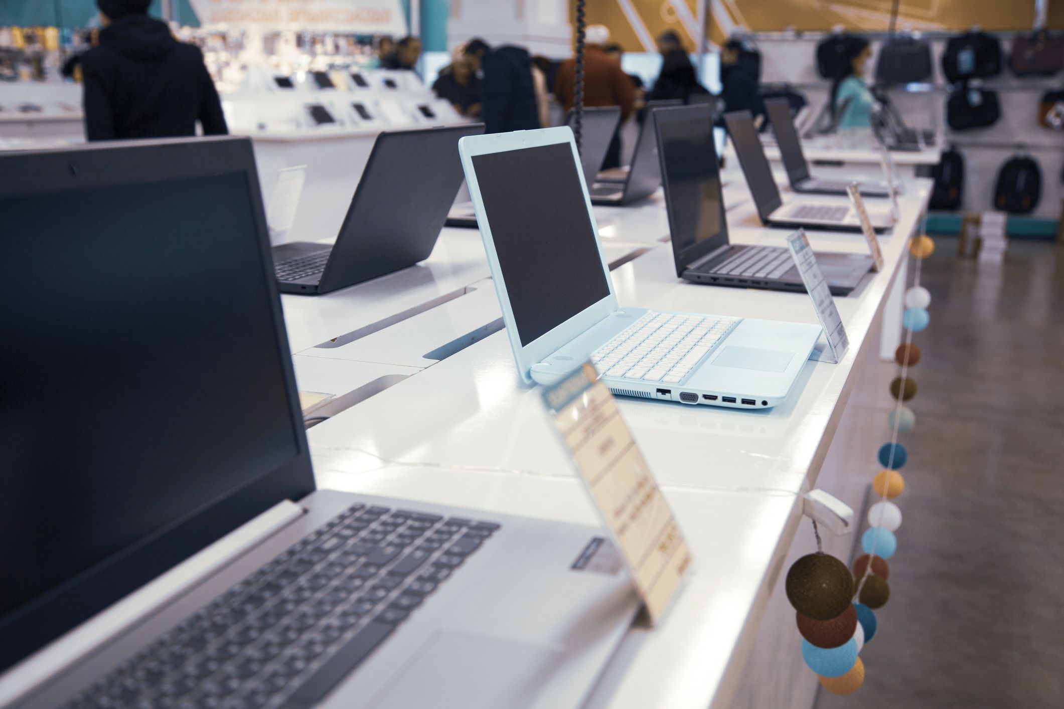 different computers in store background