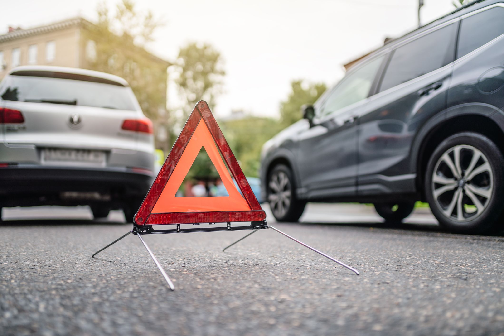 Moscow, Russia - August 21, 2021: car accident at the street of Moscow. Emergency warning triangle on the road.