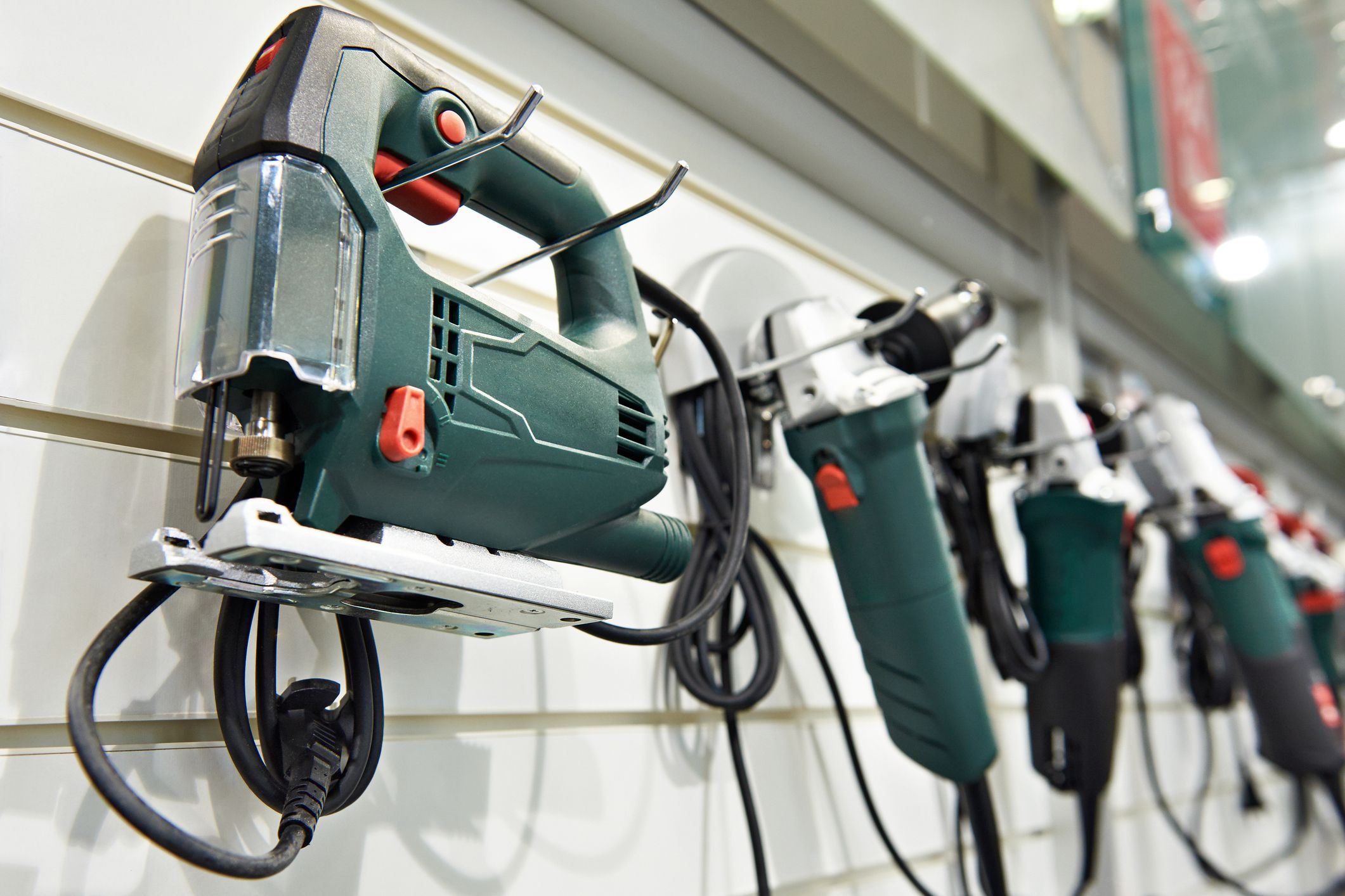 Electric tools for construction on the stand in the shop