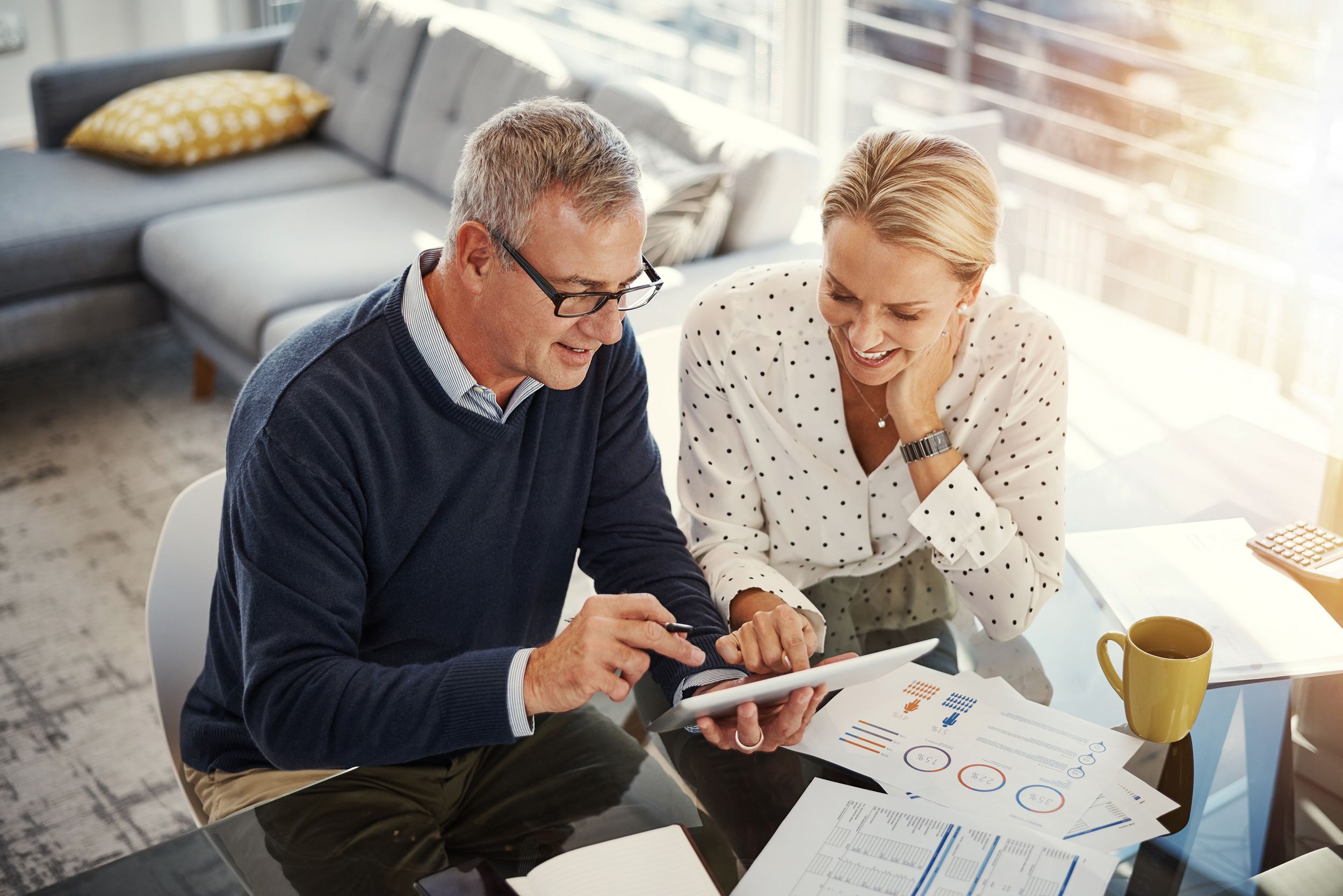 middle-aged couple doing finances at home