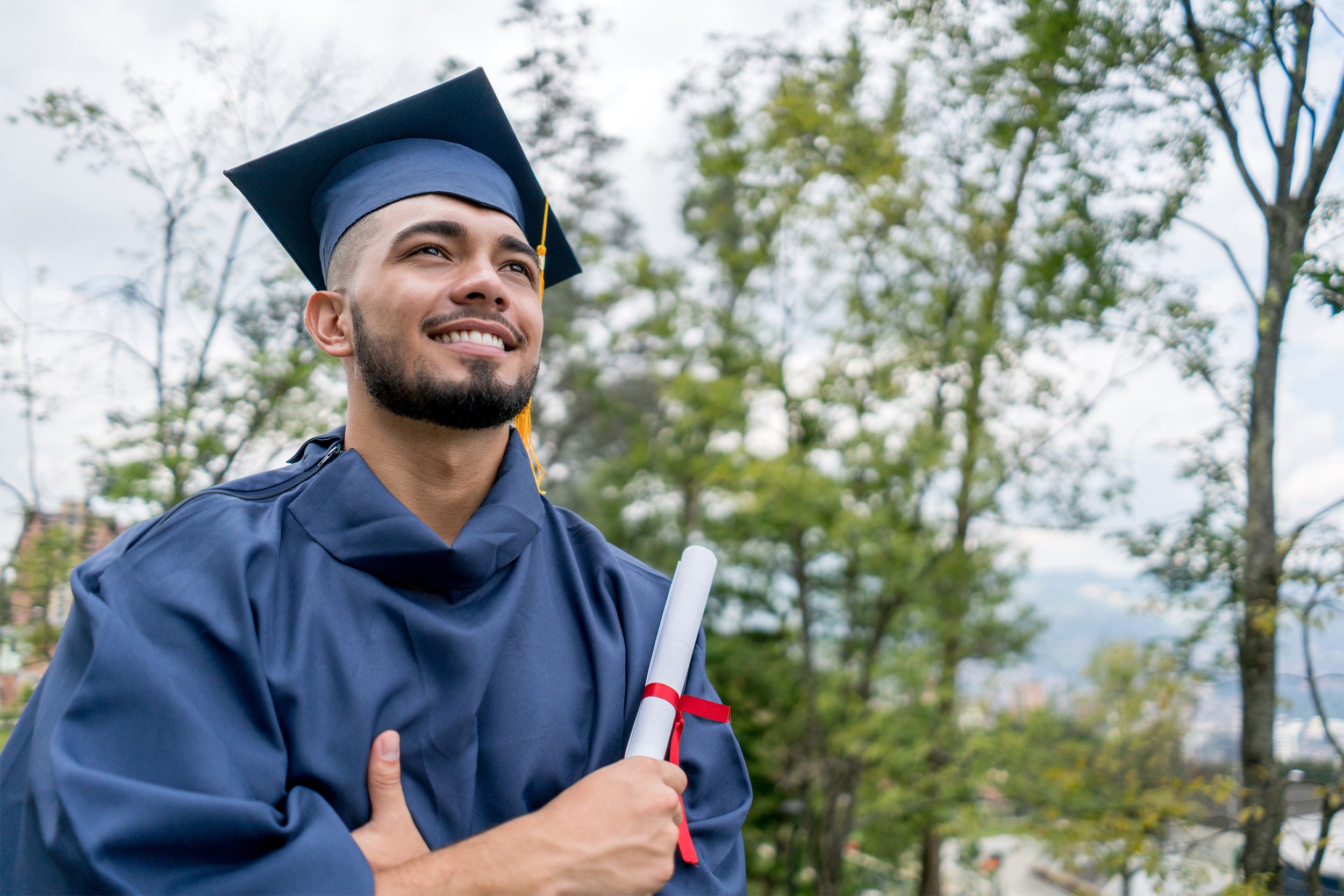 Happy college graduate with diploma