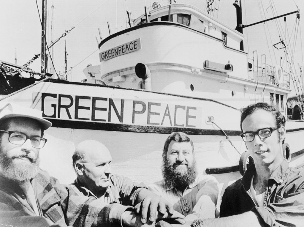 Jim Bohlen, co-coordinator for Don't Make a Wave Committee (l), with Greenpeace skipper John Cormack, and Irving Stowe and Paul Cote of the British Columbia branch of the Sierra Club (l-r) at a Vancouver harbor prior to setting sail for Amchitka Island wh