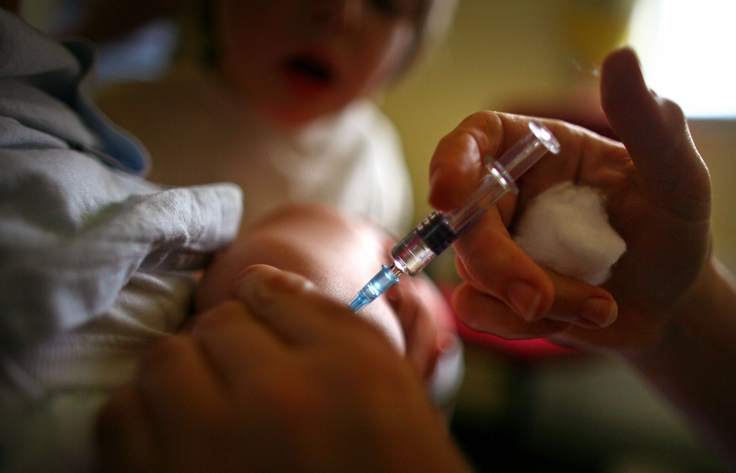 : A young boy receives a immunization jab at a health centre in Glasgow September 3, 2007 in Glasgow, Scotland