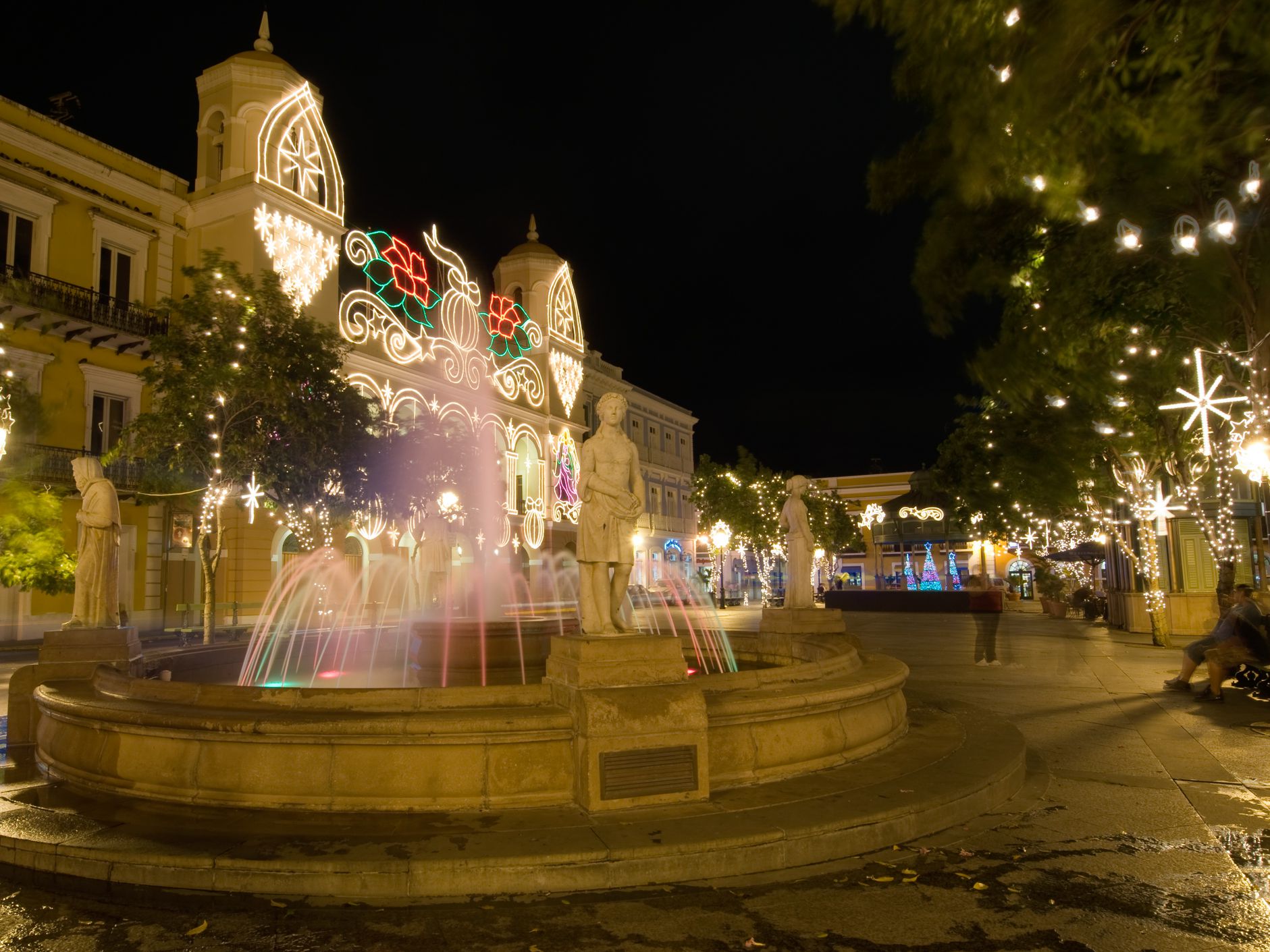 A Fountain among Christmas Light in a San Juan public square.