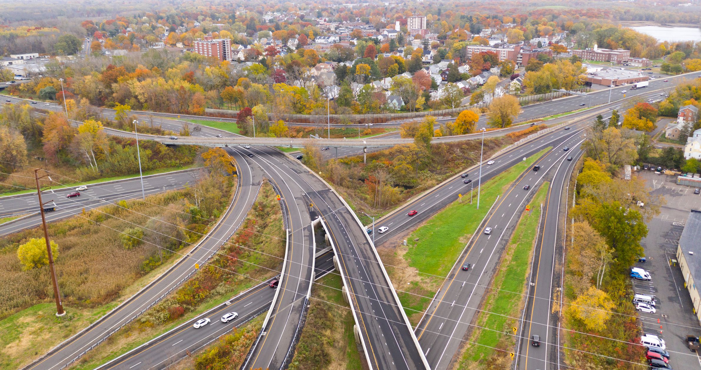 Fall color fills the tress around the urban landscape of East Hartford Connecticut in New England