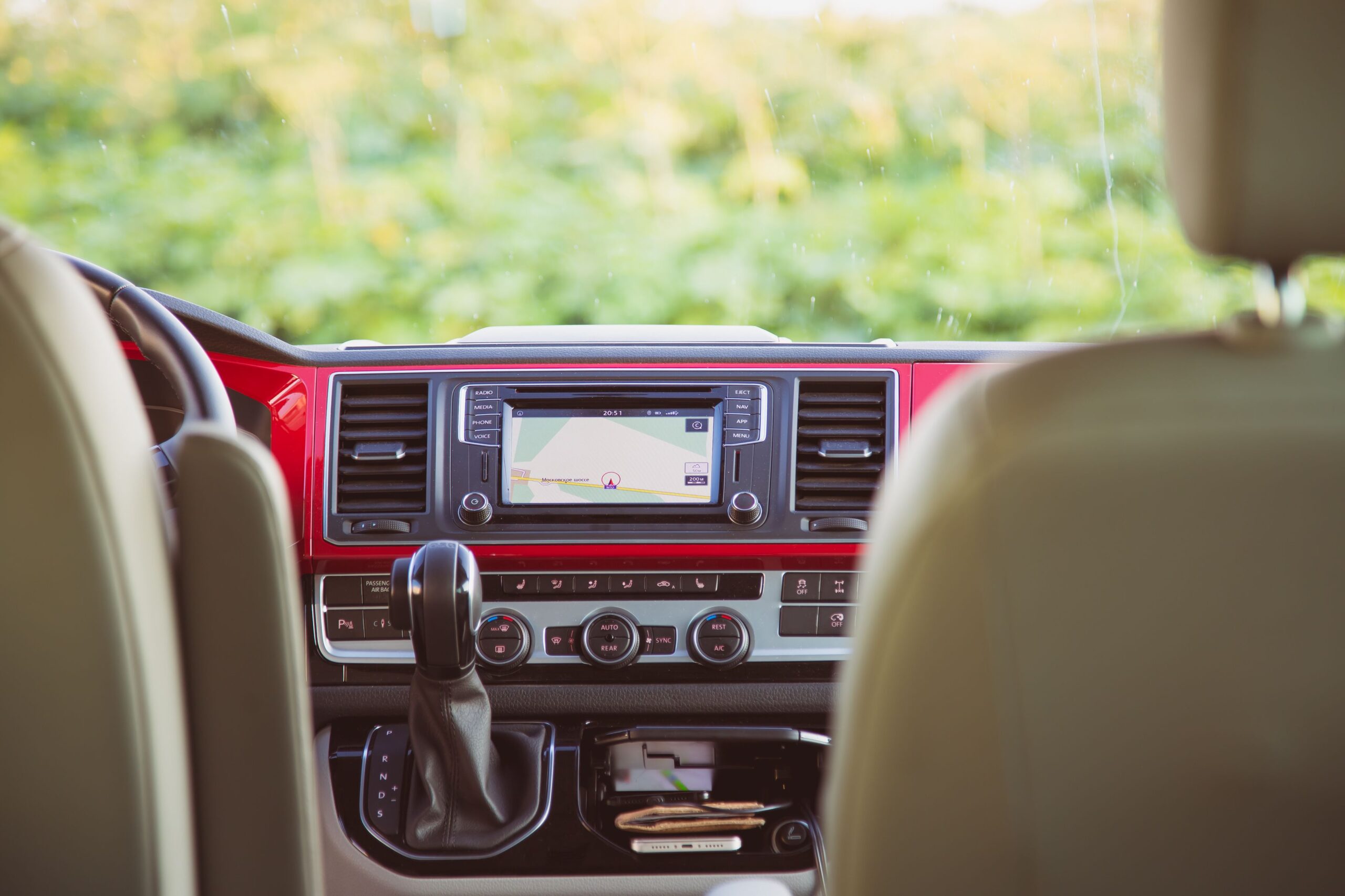 St. Petersburg, Russia - July 22, 2019: Interior of modern Volkswagen Multivan California Ocean (Transporter T6). Multimedia head unit, climate control and gear shift