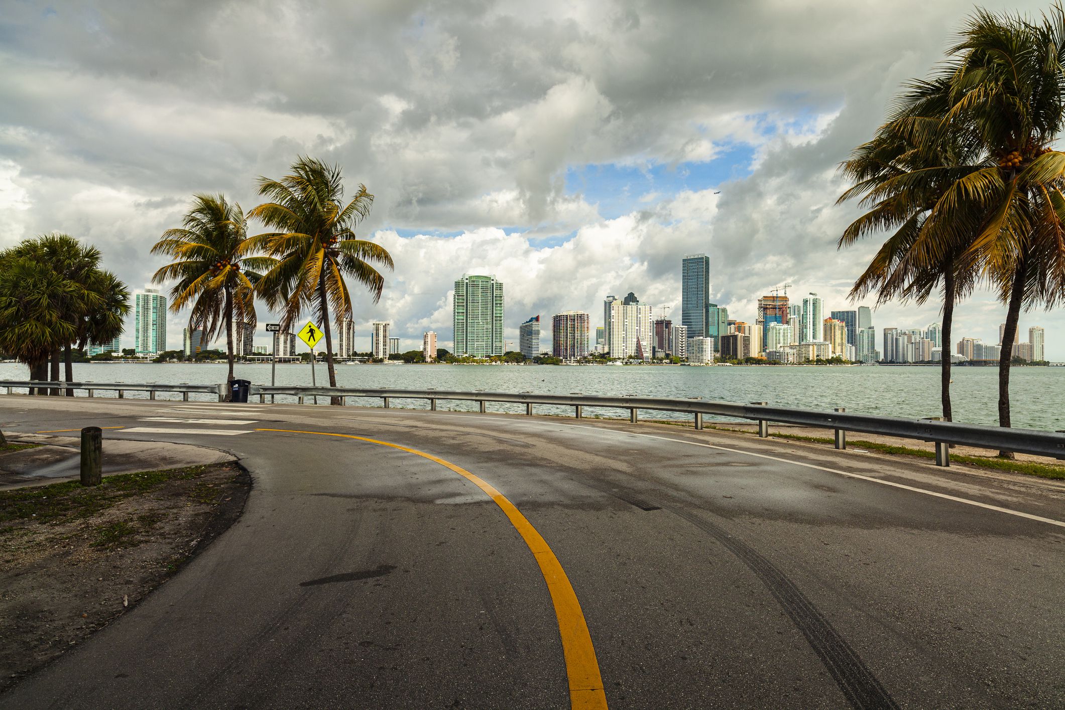 Beautiful Miami skyline along Biscayne Bay with rain clouds.
