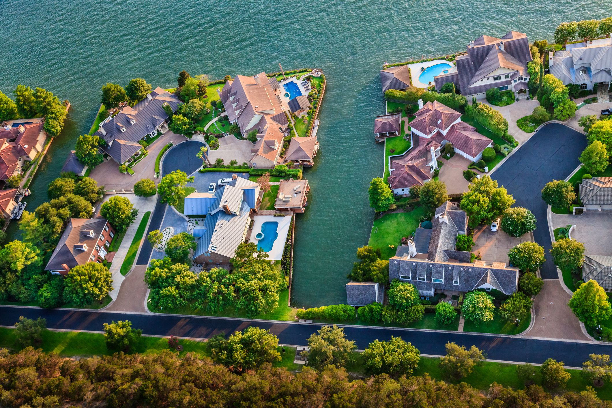 Aerial view of Luxury homes on Lake Austin section of Colorado River in Mount Bonnell district in hill country near Austin Texas. Photographed from helicoptter.