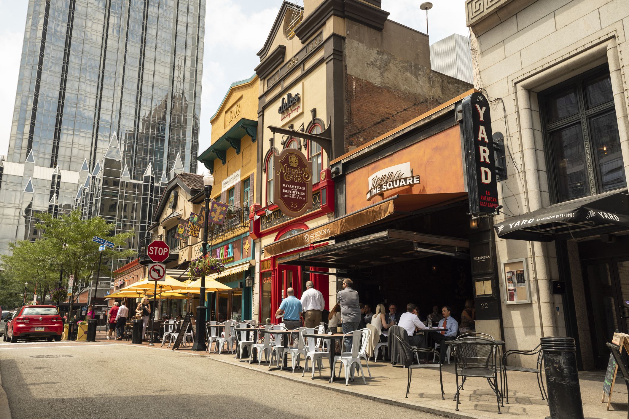 Pittsburgh, Pennsylvania, USA - June 20, 2018: People walk by the restaurants and shops in Market Square in the downtown business district of Pittsburgh Pennsylvania USA