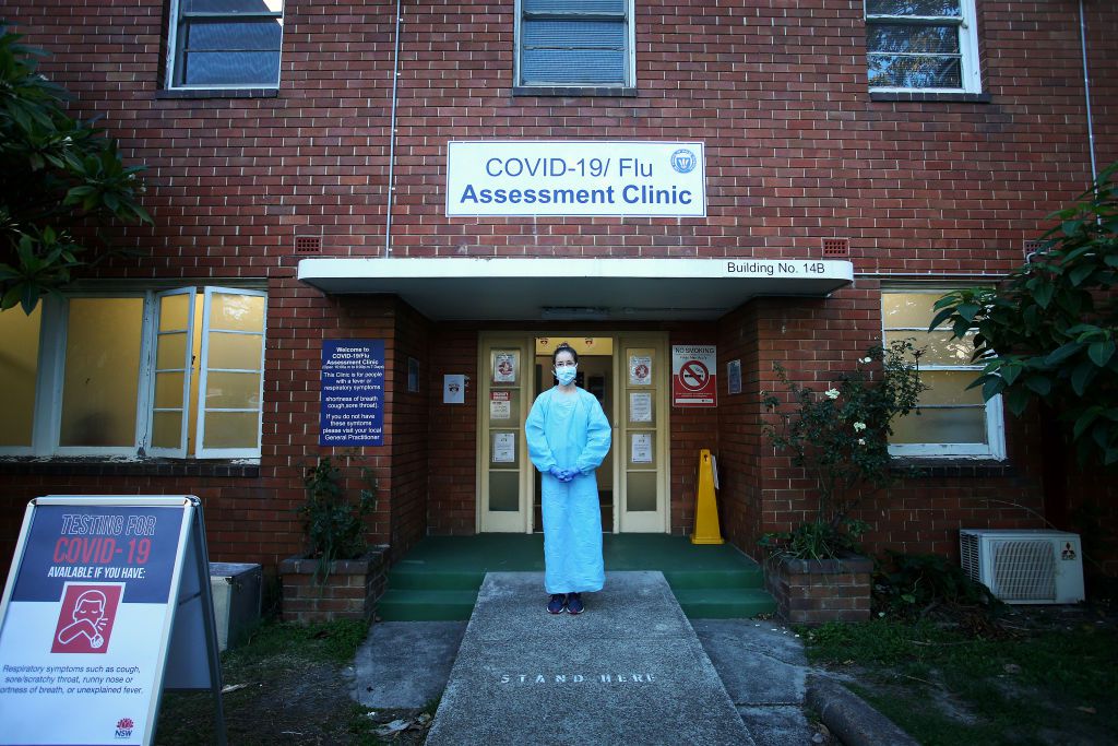 Nurse Ellen Corless stands at the entrance of the COVID-19 and Flu Assessment Clinic at Prince of Wales Hospital on May 12, 2020 in Sydney, Australia