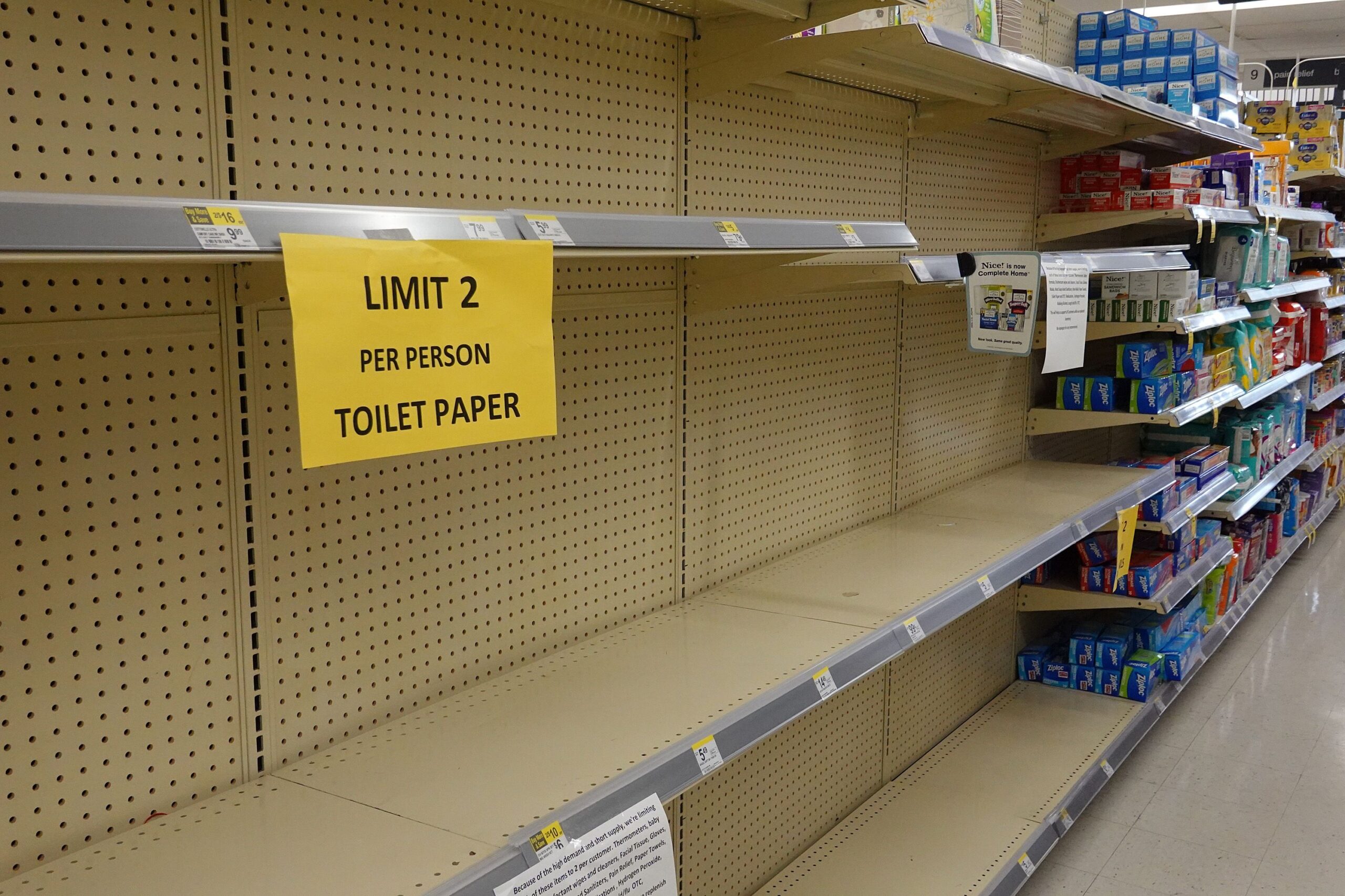 Empty shelves are seen where toilet paper normally is kept in a store in Key West, Florida during COVID-19