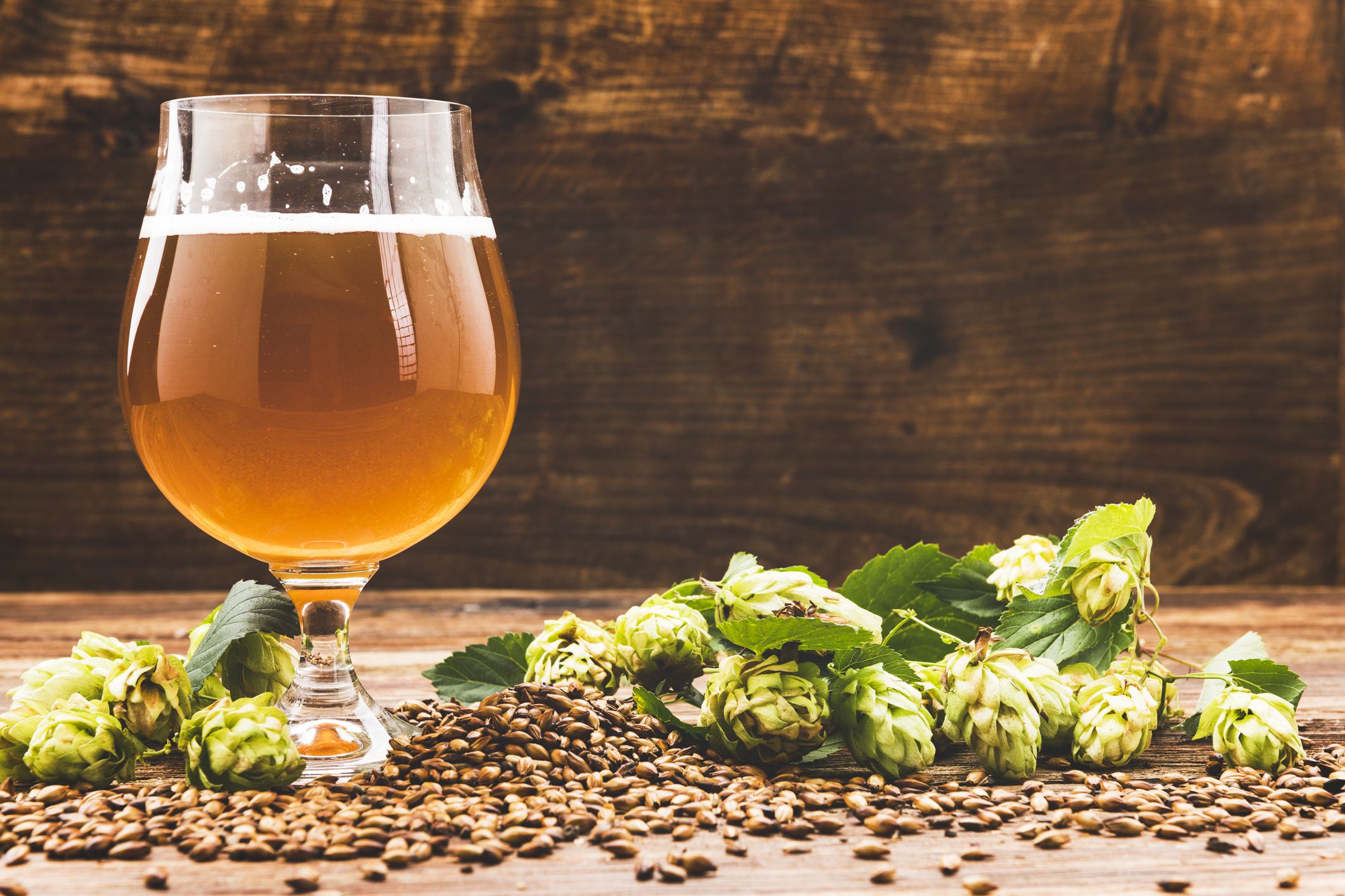 Glass of beer on wooden background