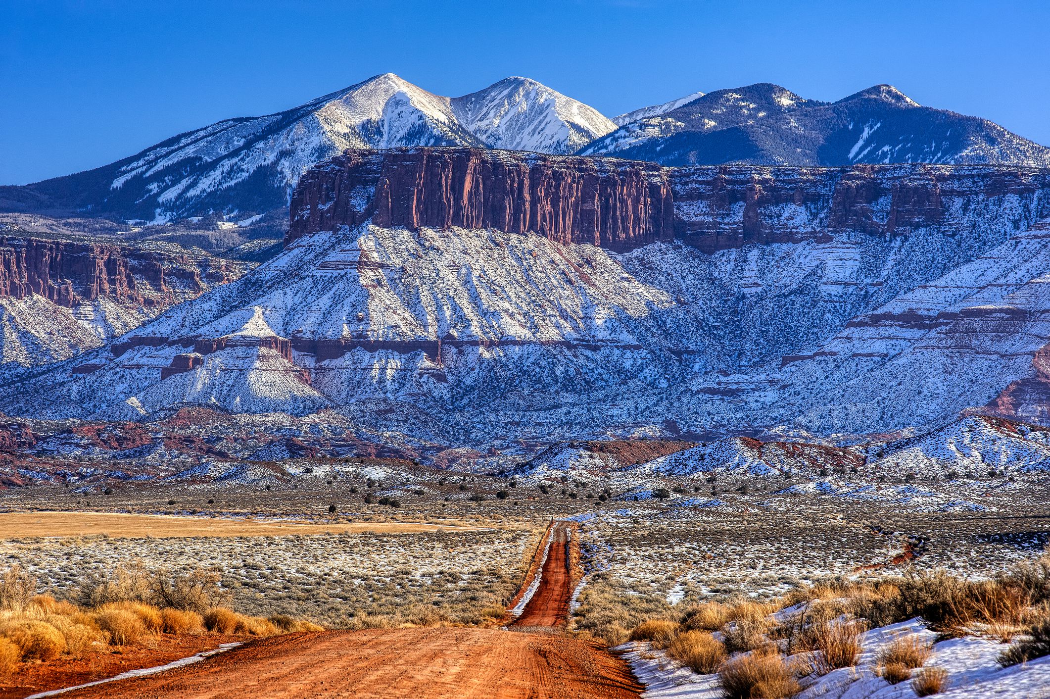 Dirt Road Moab Utah Canyonlands. Horizontal composition, barren desert environment. ProPhoto RGB.