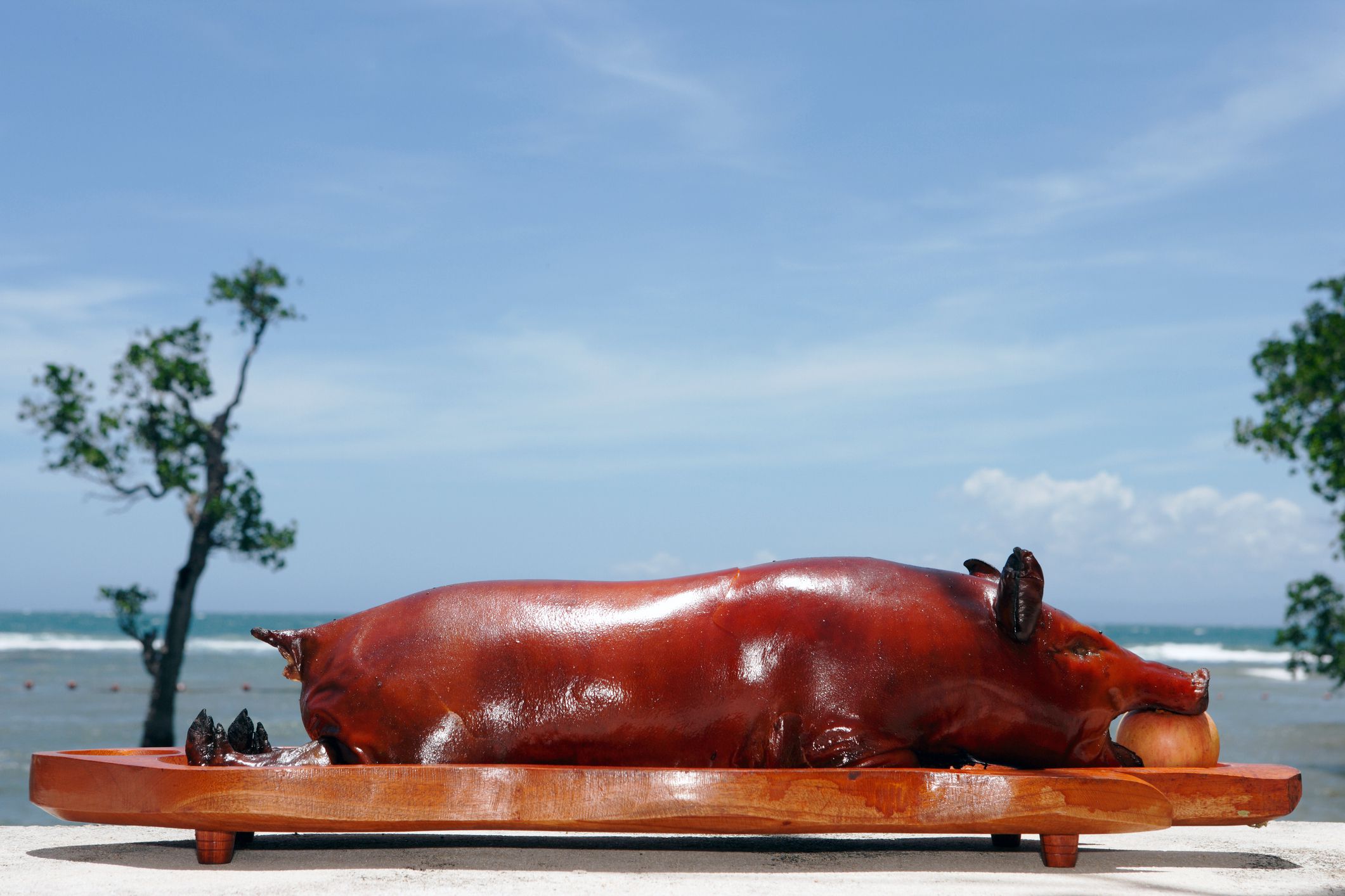 colombian lechona in front of beach