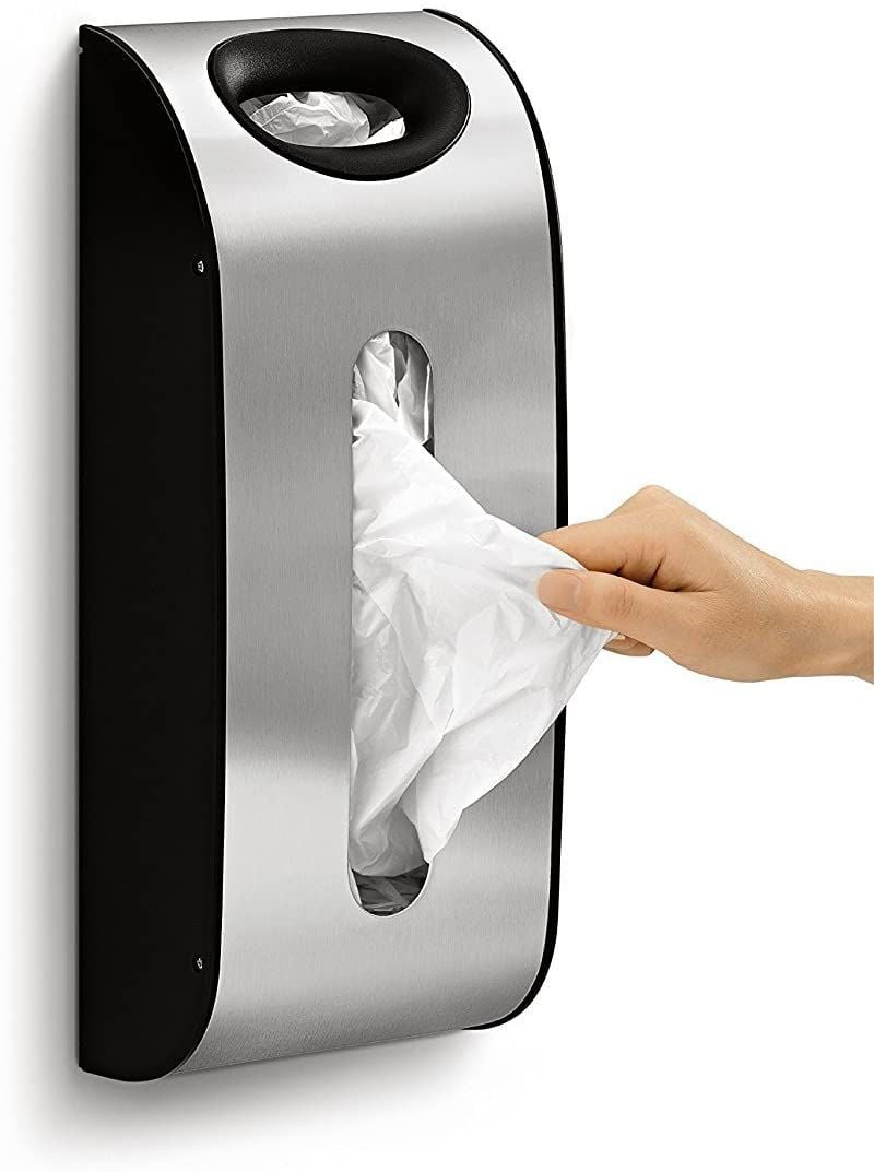 Simplehuman Wall Mount Grocery Bag Dispenser with a hand pulling out a white garbage bag