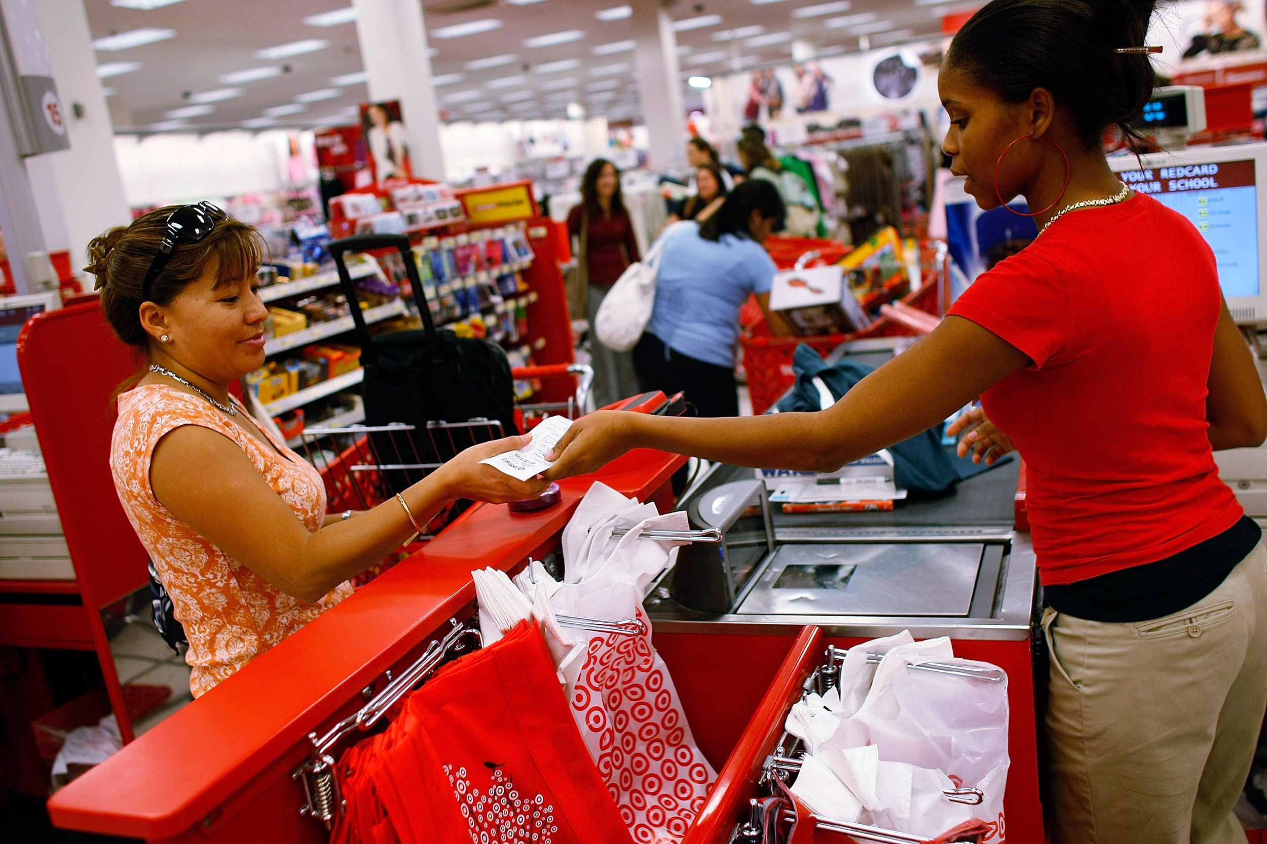 customer receives her change from Target cashier