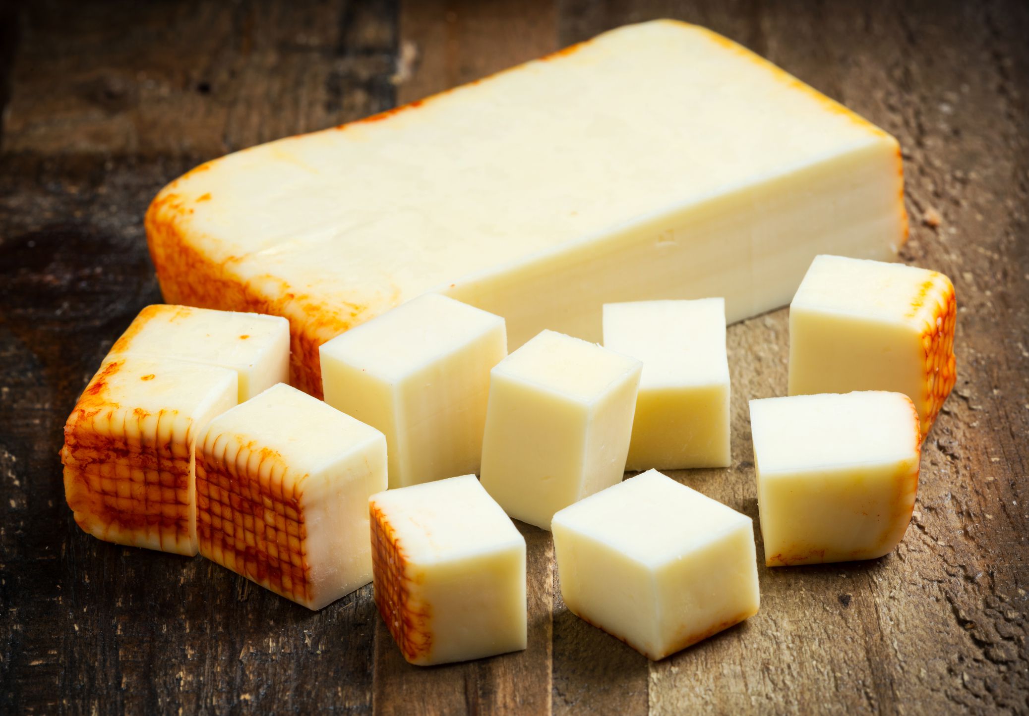 Muenster Cheese over a wooden table