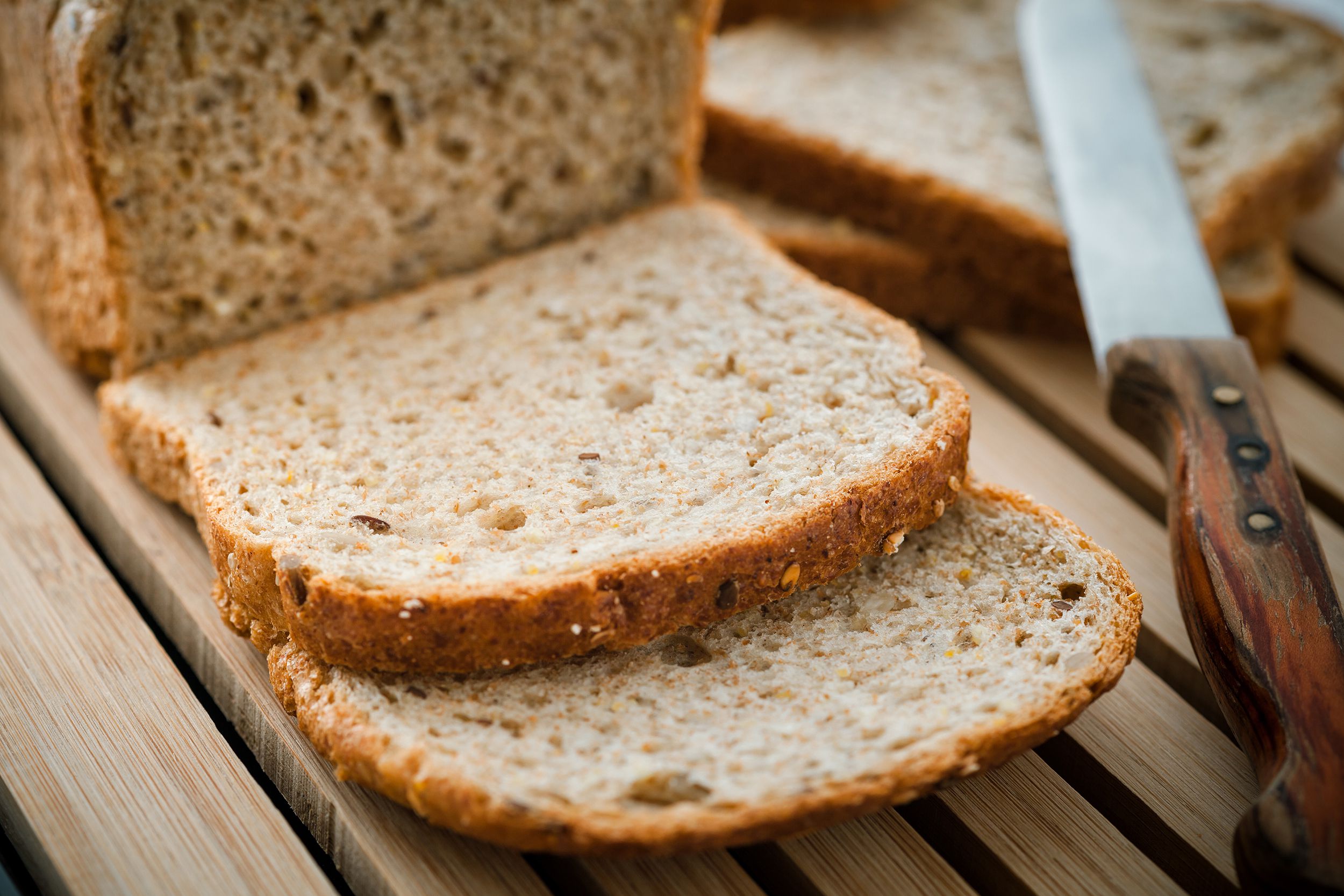 cut pieces of bread from loaf