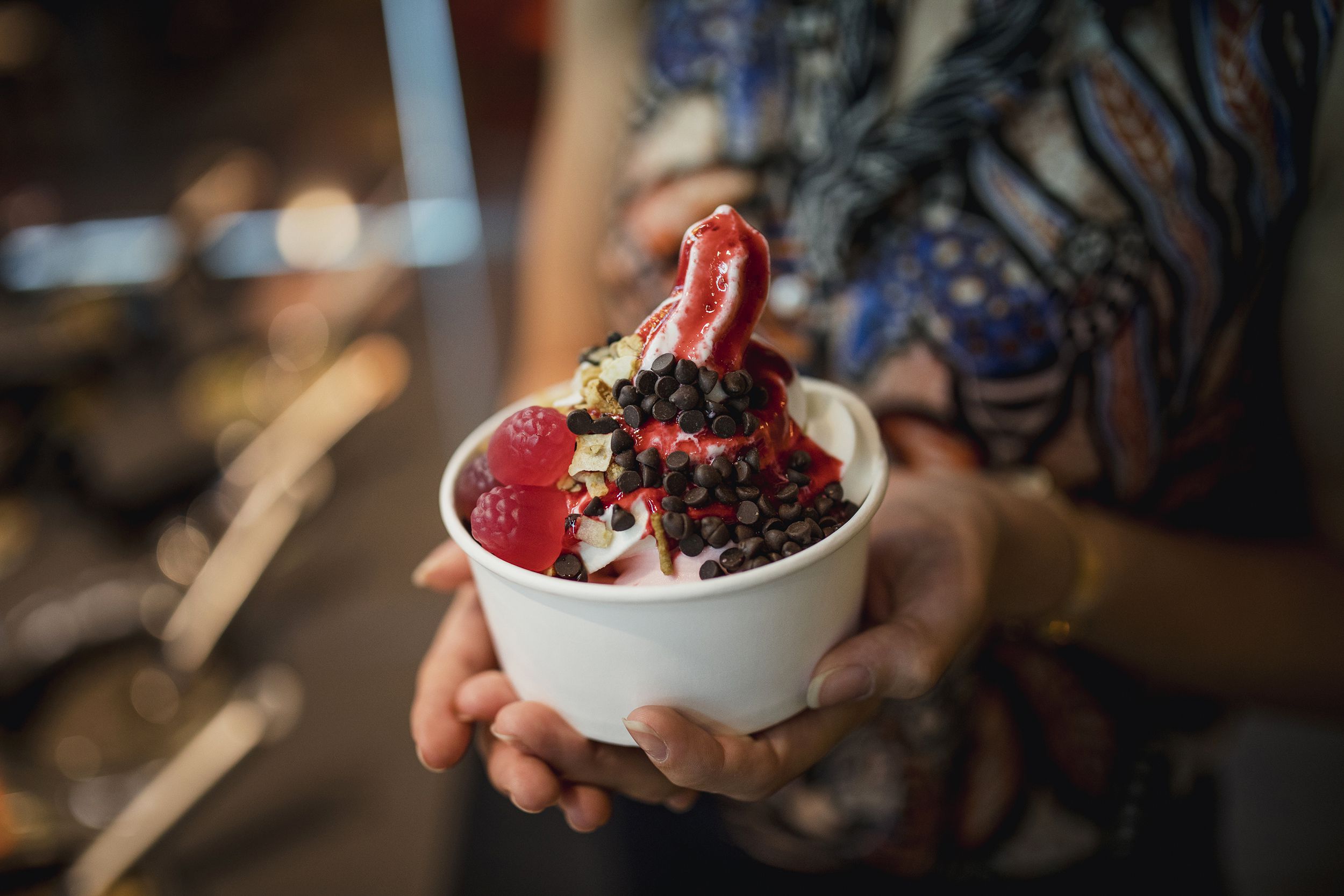 woman holding frozen yogurt