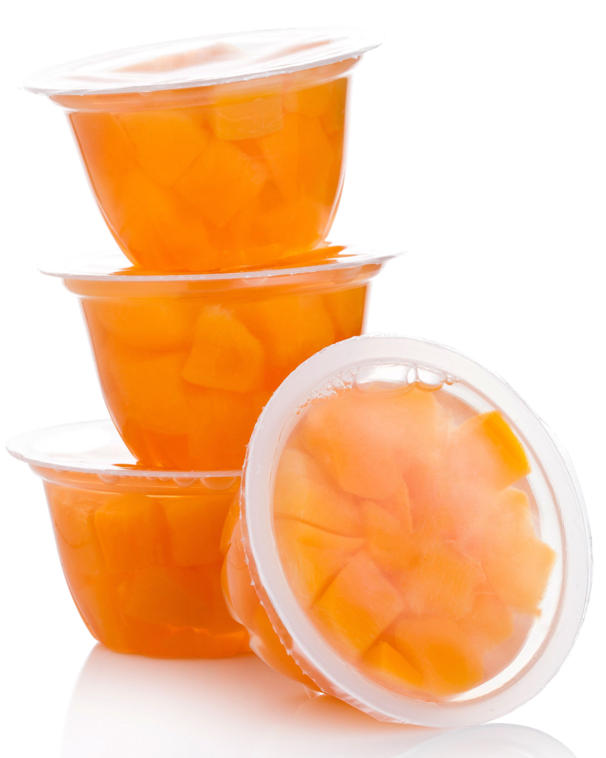 single cups with peach in fruit jelly