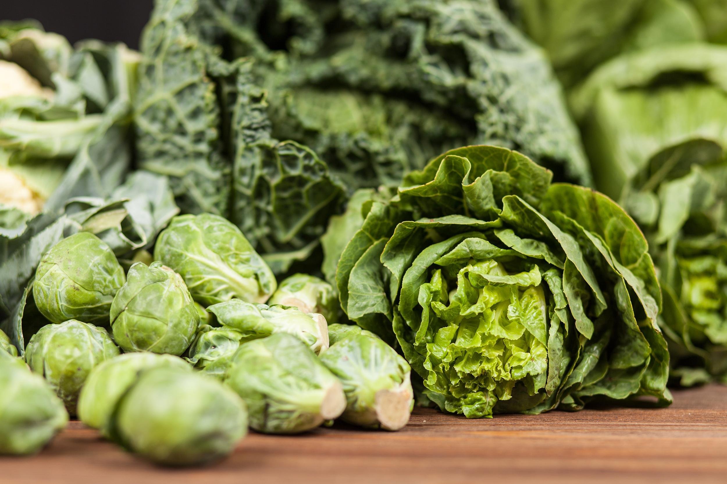 assortment of green vegetables on wooden surface