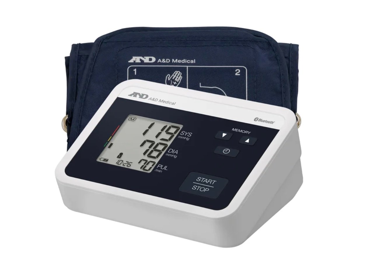 A digital blood pressure monitor with a black cuff and a display showing systolic, diastolic, and pulse readings. The device has buttons labeled "START/STOP" and "MEMORY"—perfect for those seeking Costco deals for seniors.