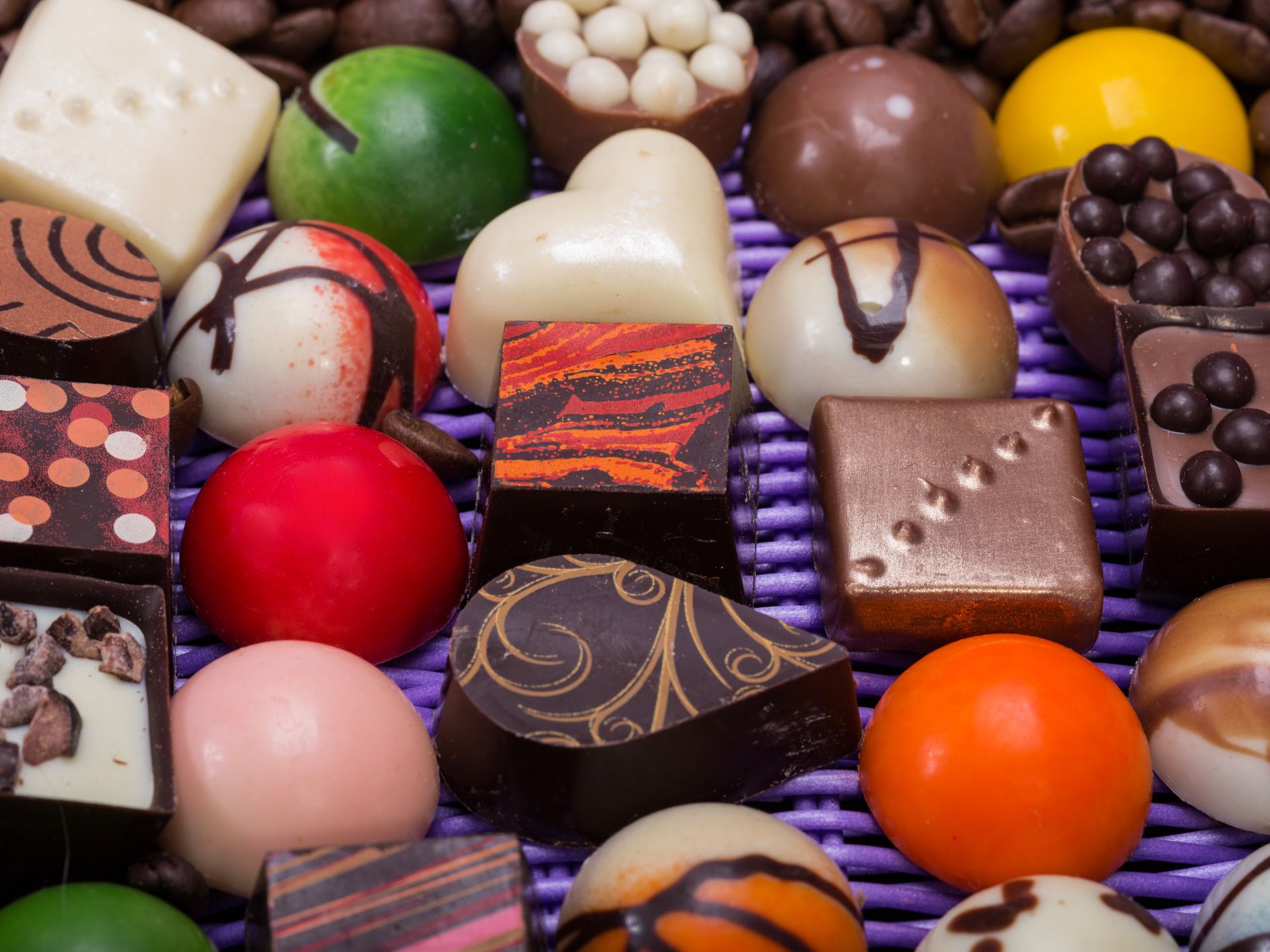 Set of a various chocolate pralines and coffee beans