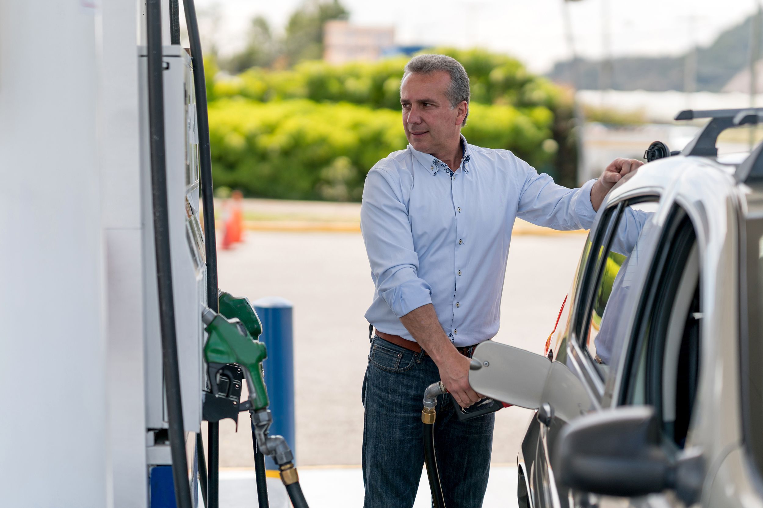 Man pumping gas