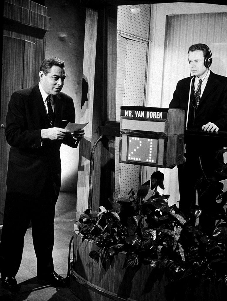 Charles Van Doren in the isolation booth on the quiz show Twenty-One, with host Jack Barry (1957)