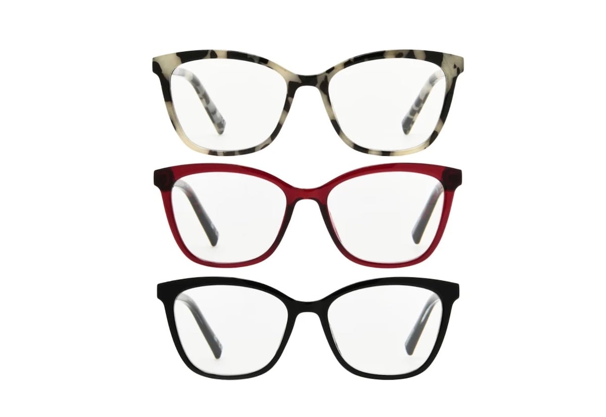Three pairs of eyeglasses with rectangular frames are stacked vertically, showcasing stylish options that could complement any look—perfect for those seeking Costco deals for seniors. The top pair is white and gray tortoiseshell, the middle is red, and the bottom is black.